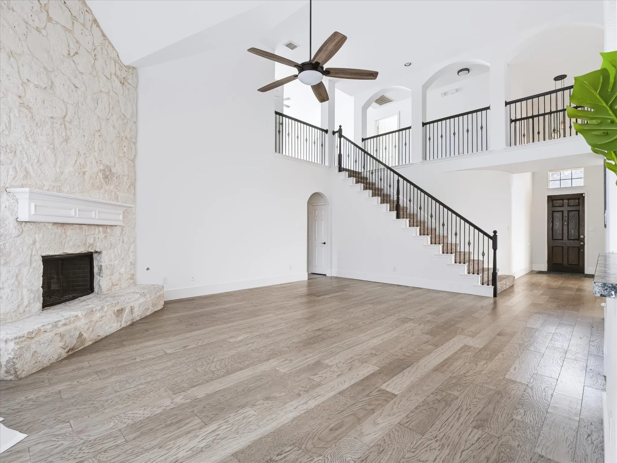 Wood or gas burning fireplace with raised hearth