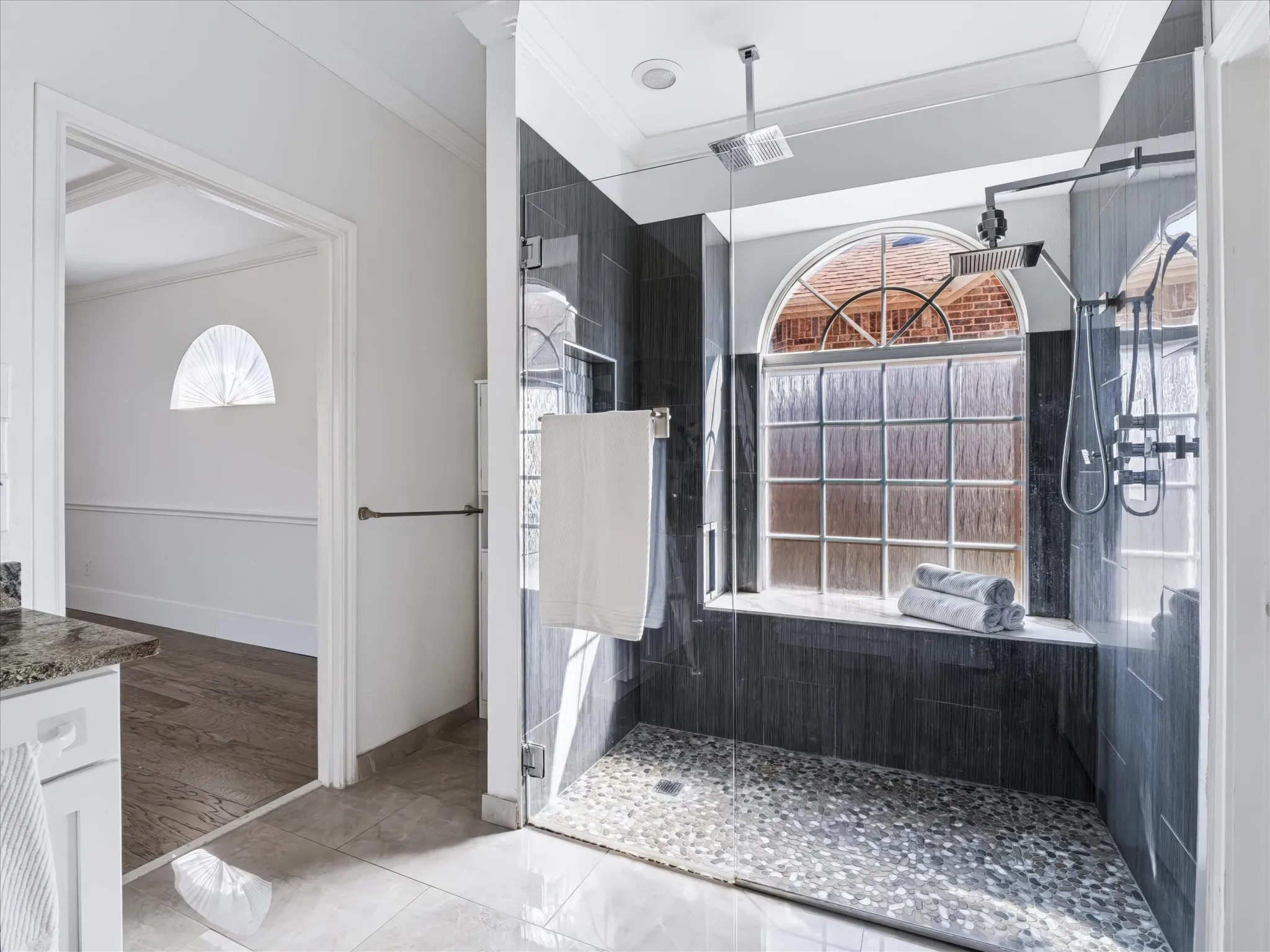 Over sized walk in shower with rainfall showerhead and multiple body jets
