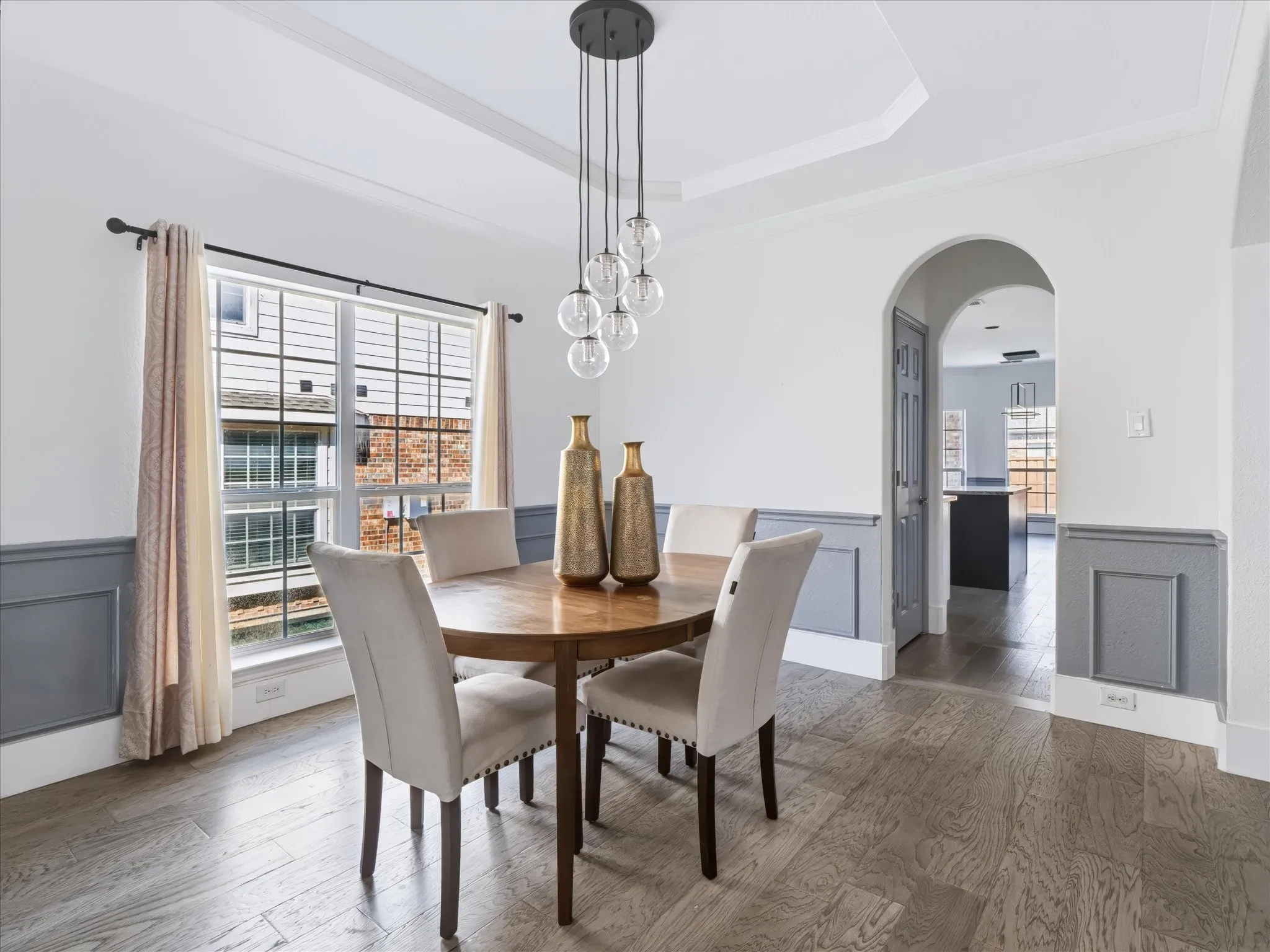 Separate formal dining with decorative lighting