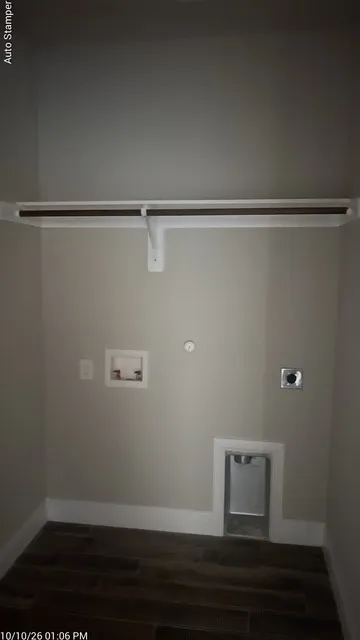 Wood-finish flooring, laundry hookups, and a built-in hanging rod