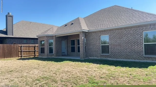 Brick exterior with covered patio