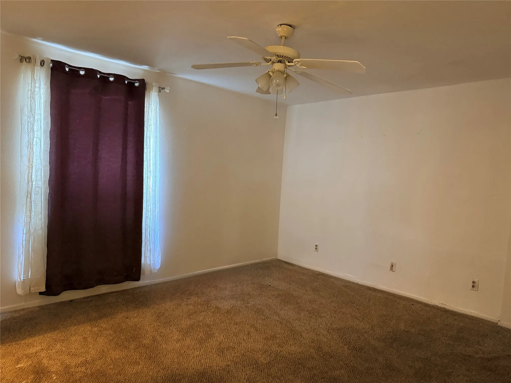 Wall-to-wall carpeting and neutral wall tones