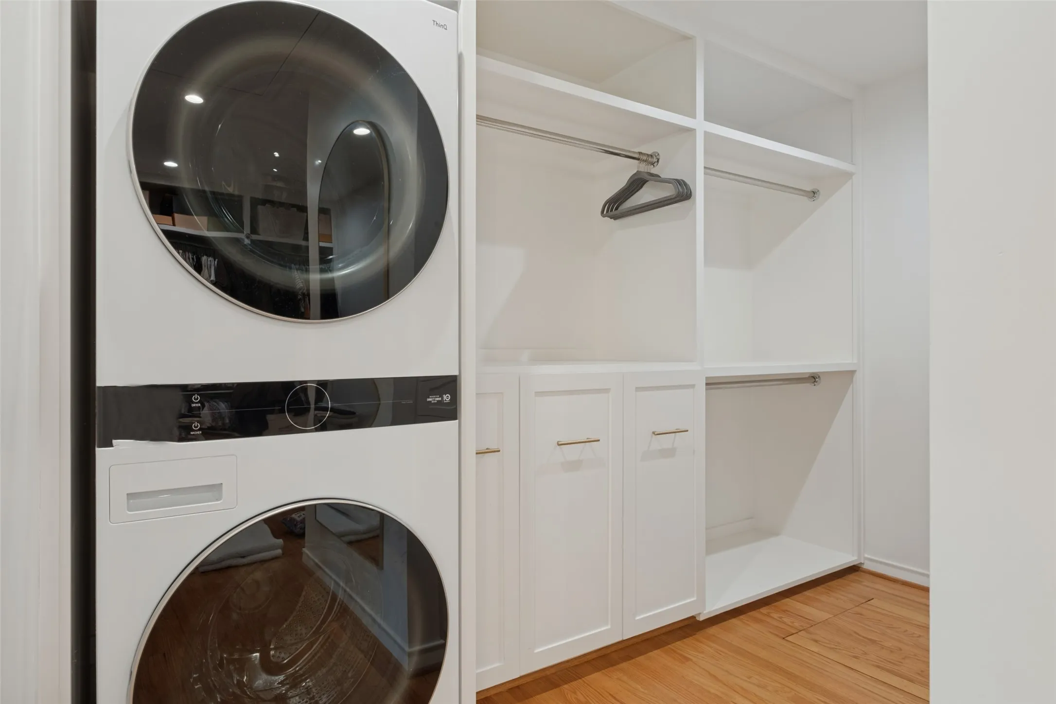 Washer & dryer in primary master closet for ease with lots of storage.