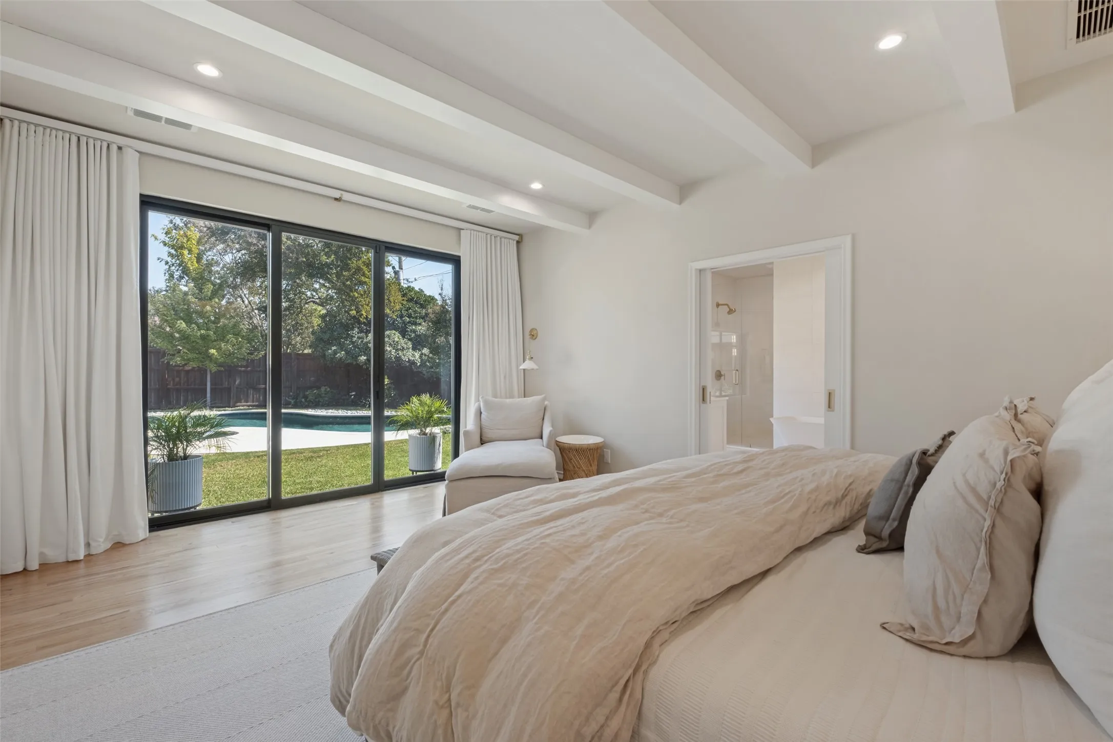 Peaceful and split from the other bedrooms with access to the lush yard.