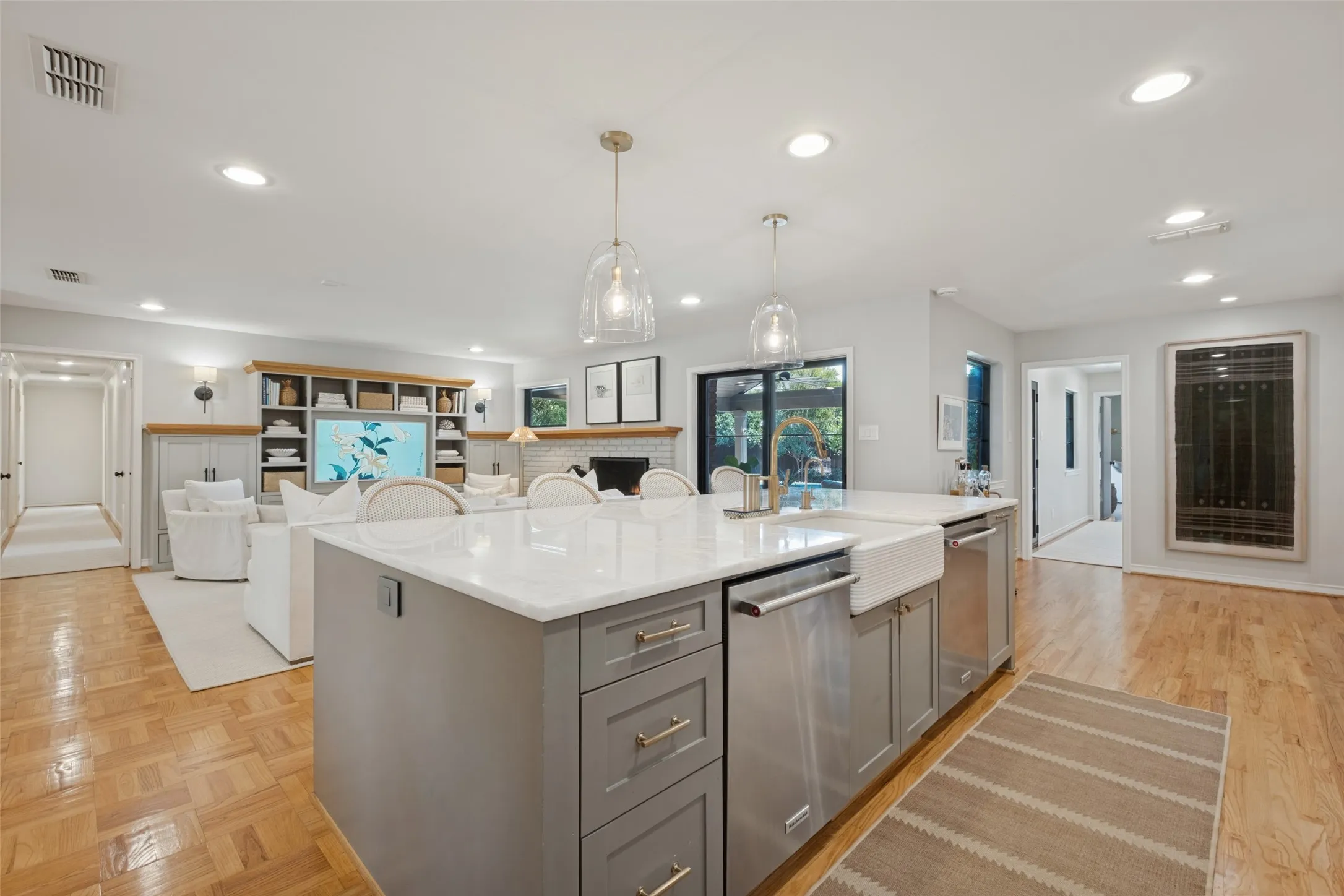Oversized island with double dishwashers, farm sink and storage.
