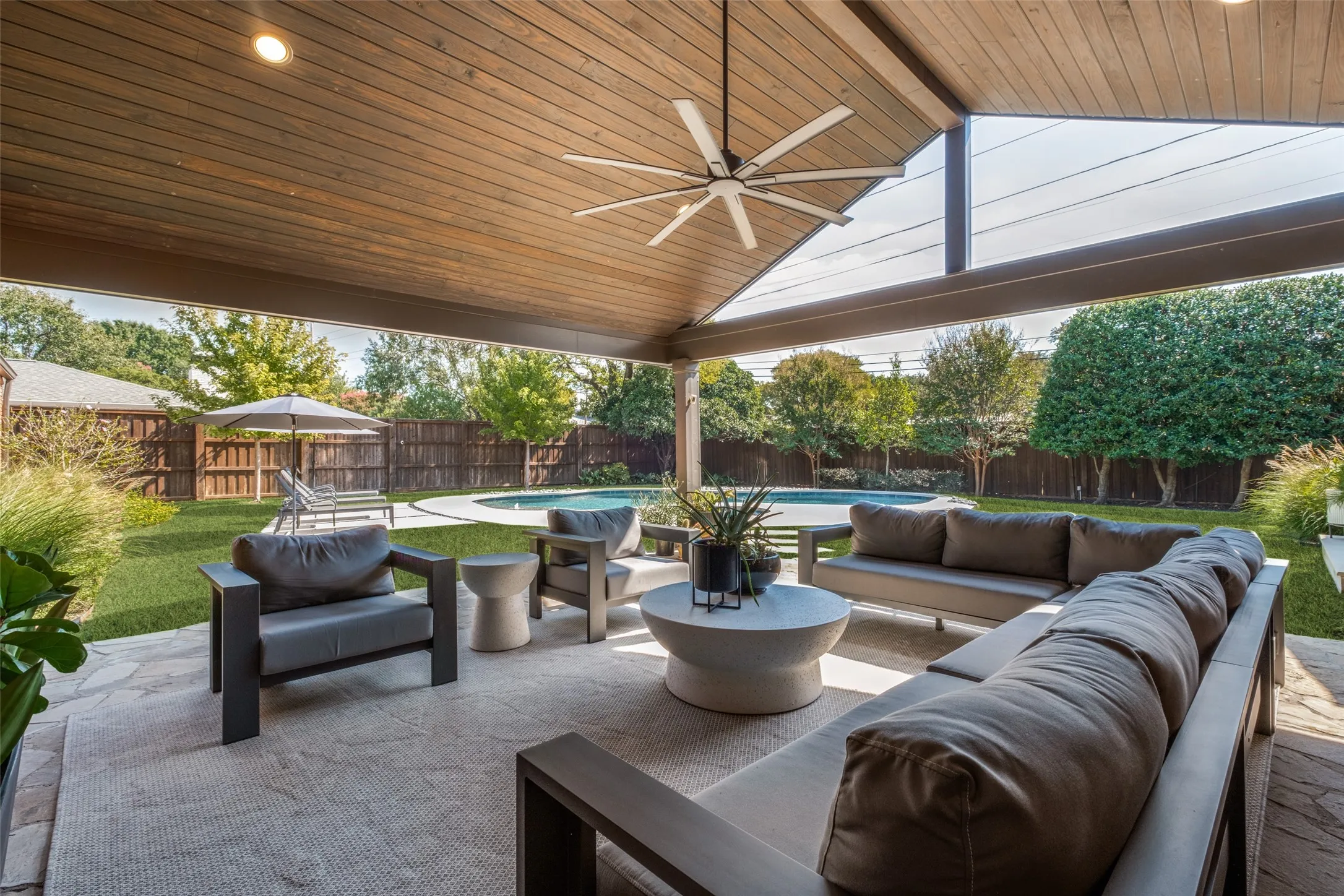 Attached outdoor living space with TV & fan 22x21