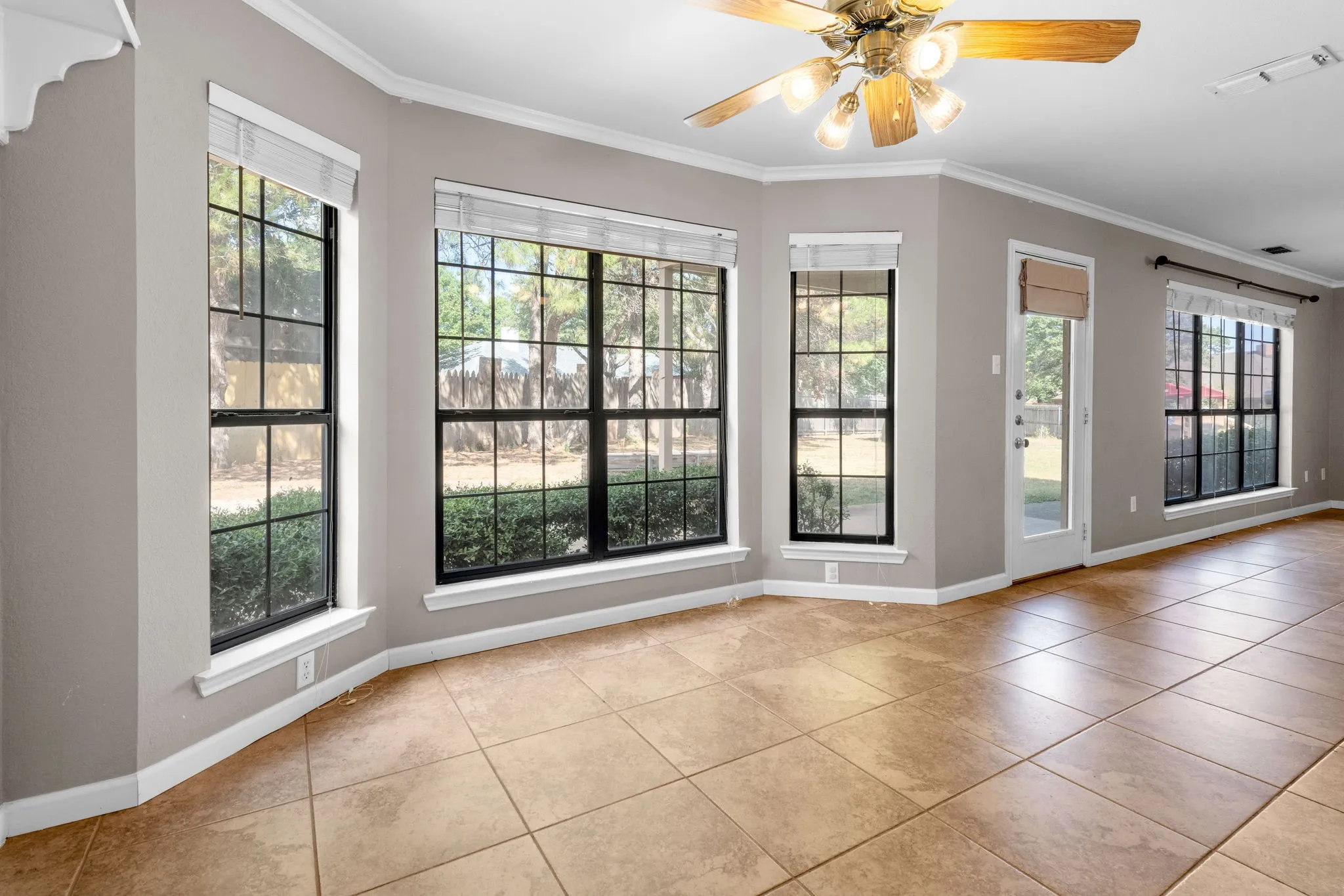 Breakfast area overlooks the private back yard and living room to the right.