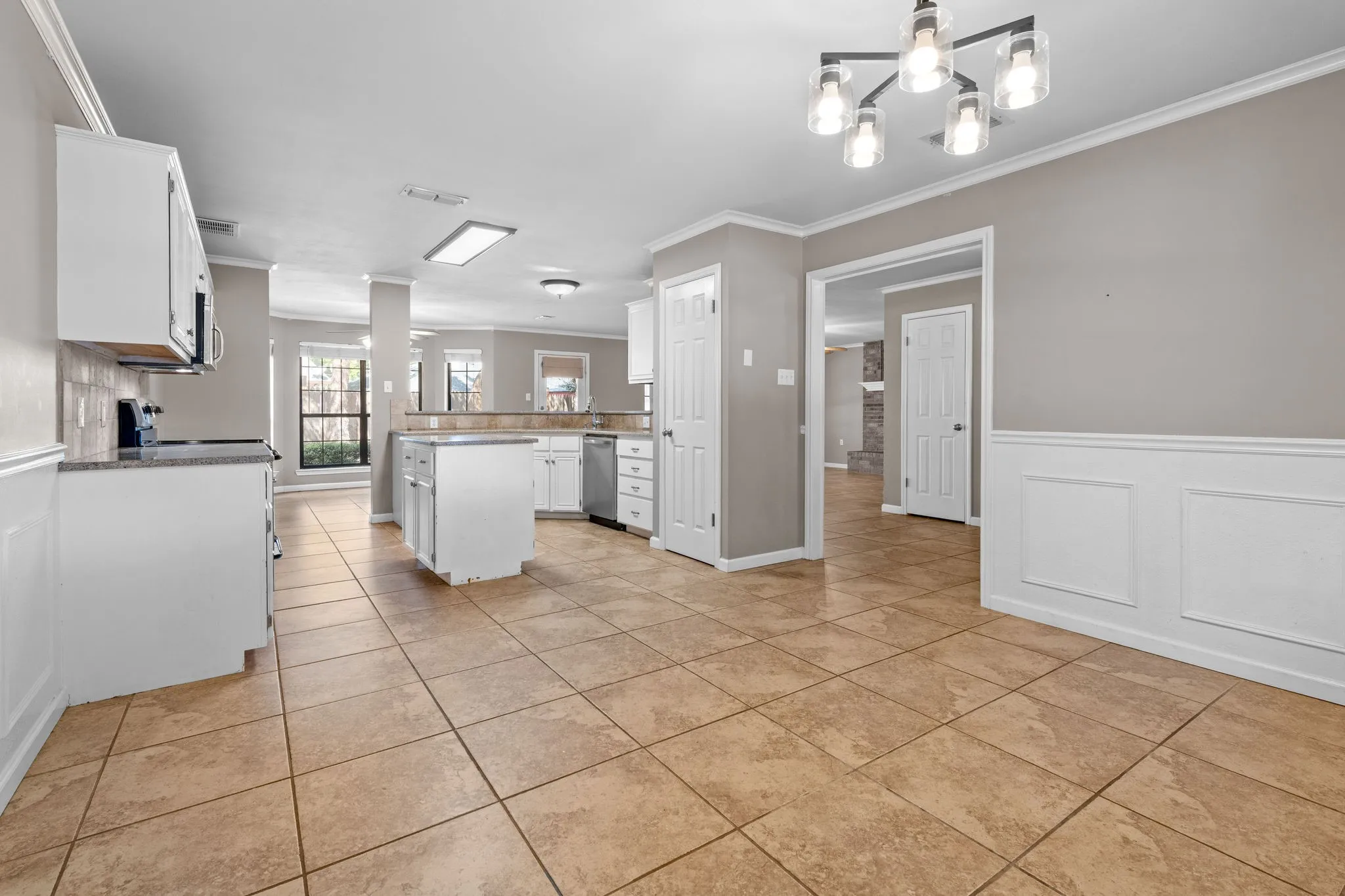 Dining area conveniently flows into the spacious kitchen.