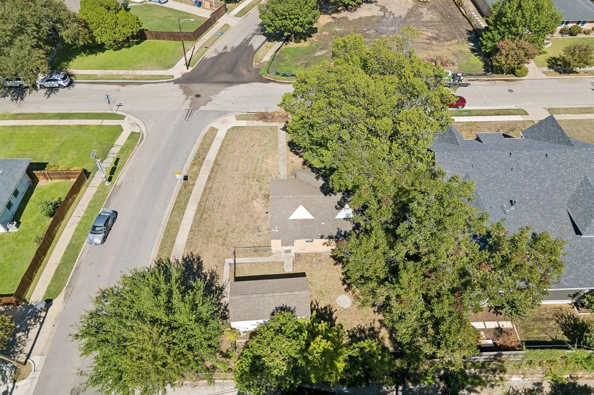 Aerial view north. The lot across the street of 3802 Dunhaven has been cleared.Lots of new construction nearby.