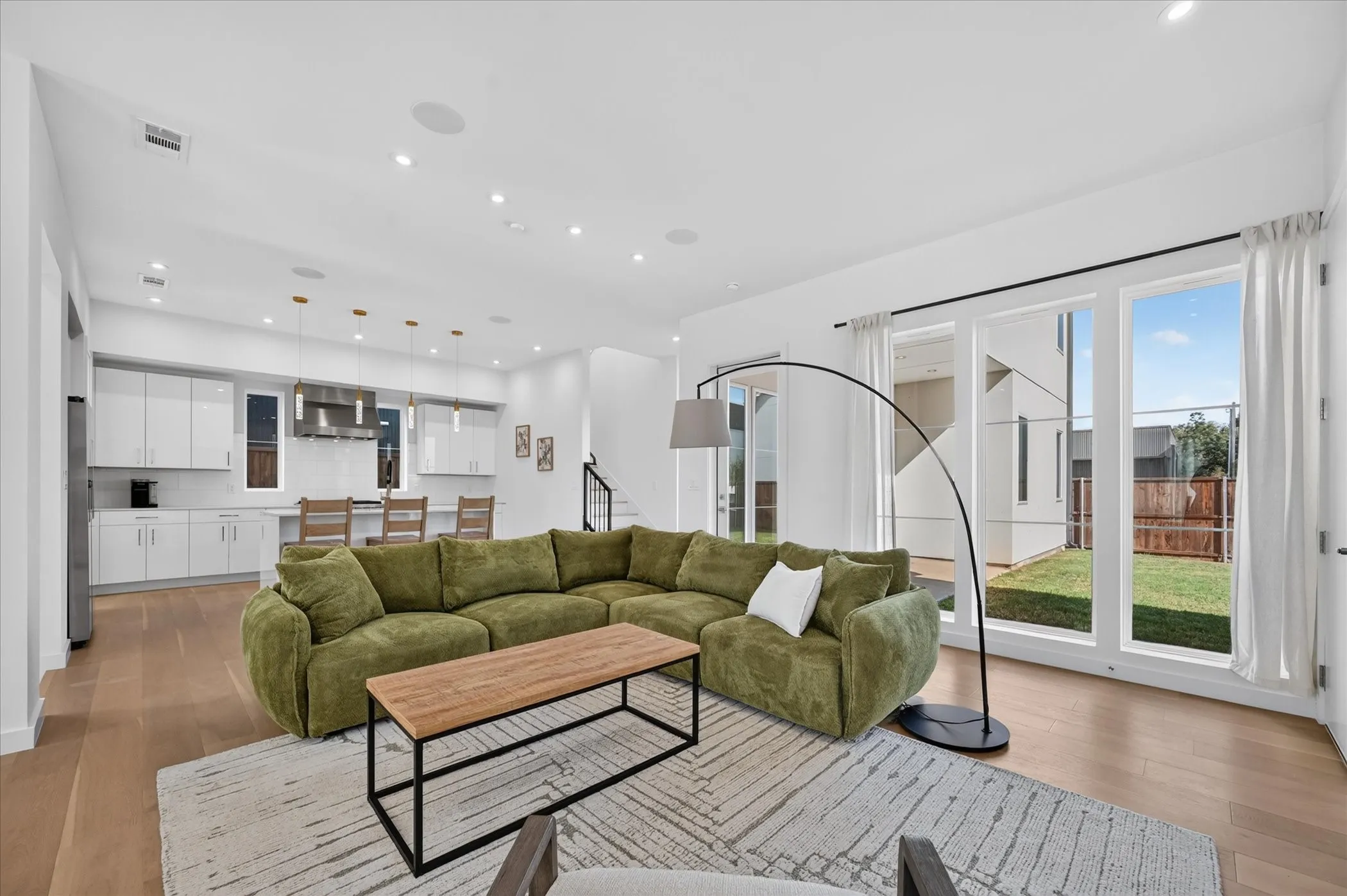 Open concept living area with wood-finish flooring