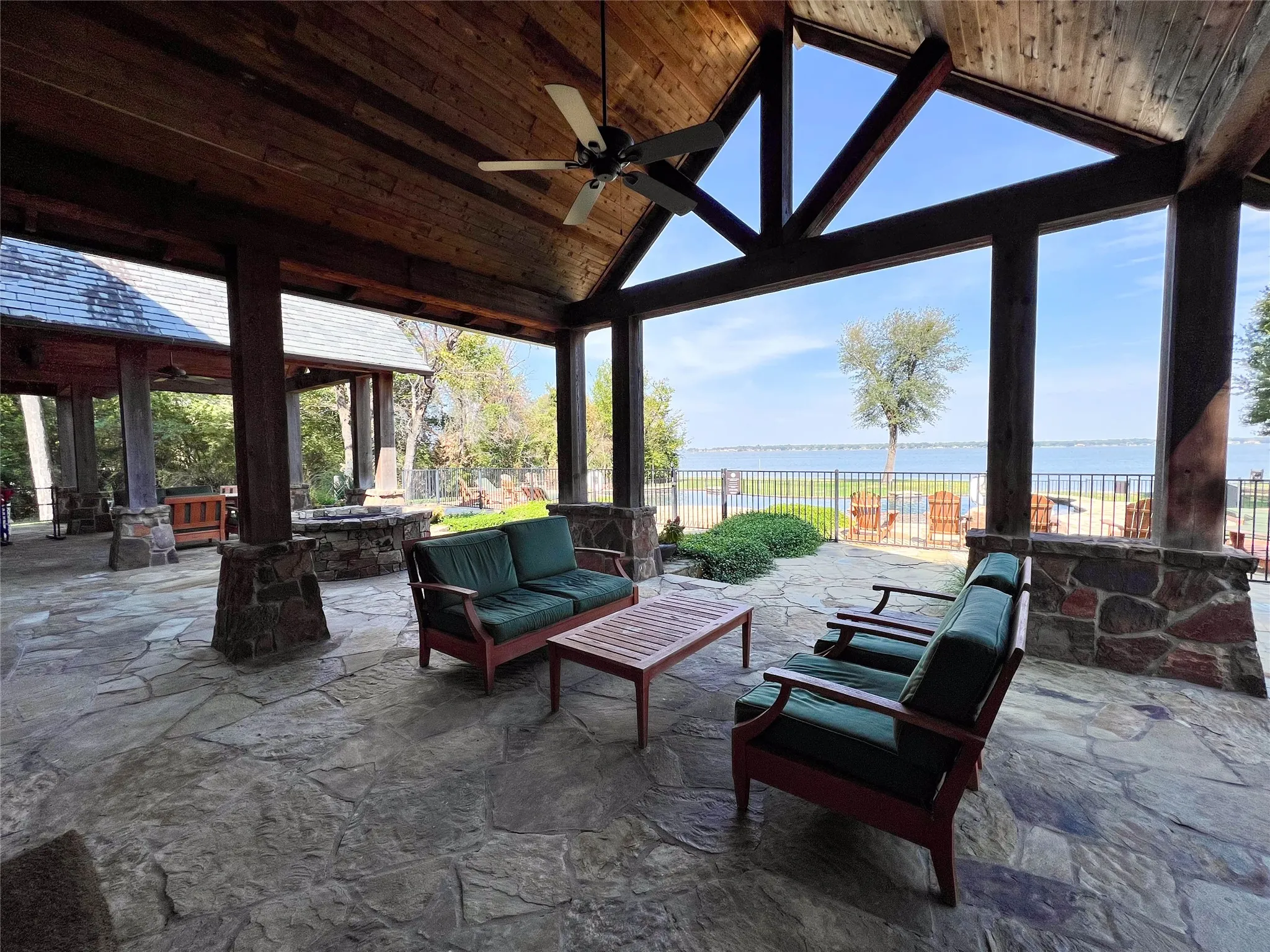 505 Ranch clubhouse covered patio with firepit overlooking the pool and lake