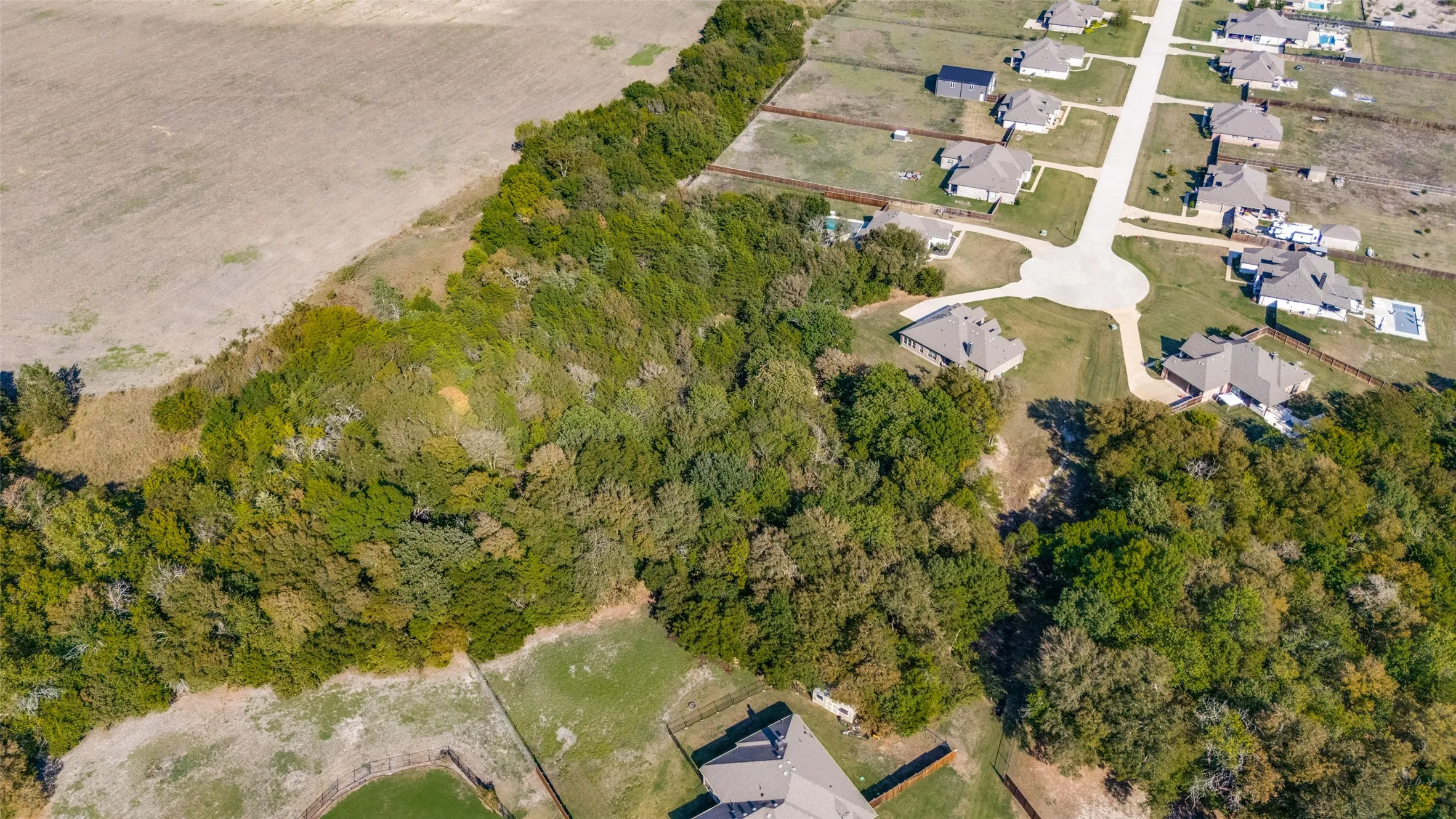 Expansive wooded acreage with a cleared perimeter and undeveloped open land