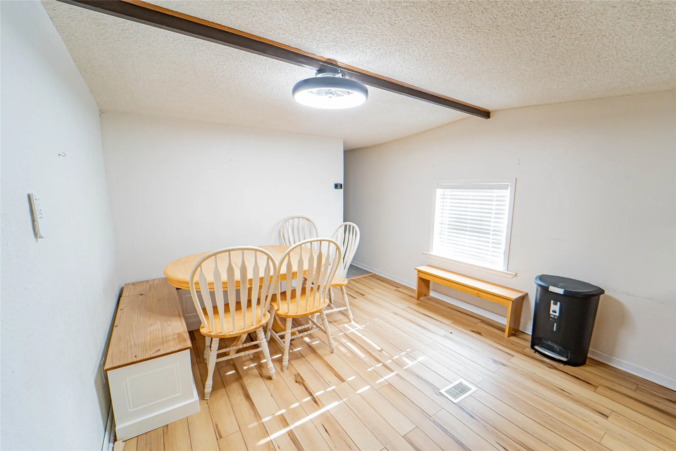 Hardwood-finish flooring, recessed lighting, and a window with blinds