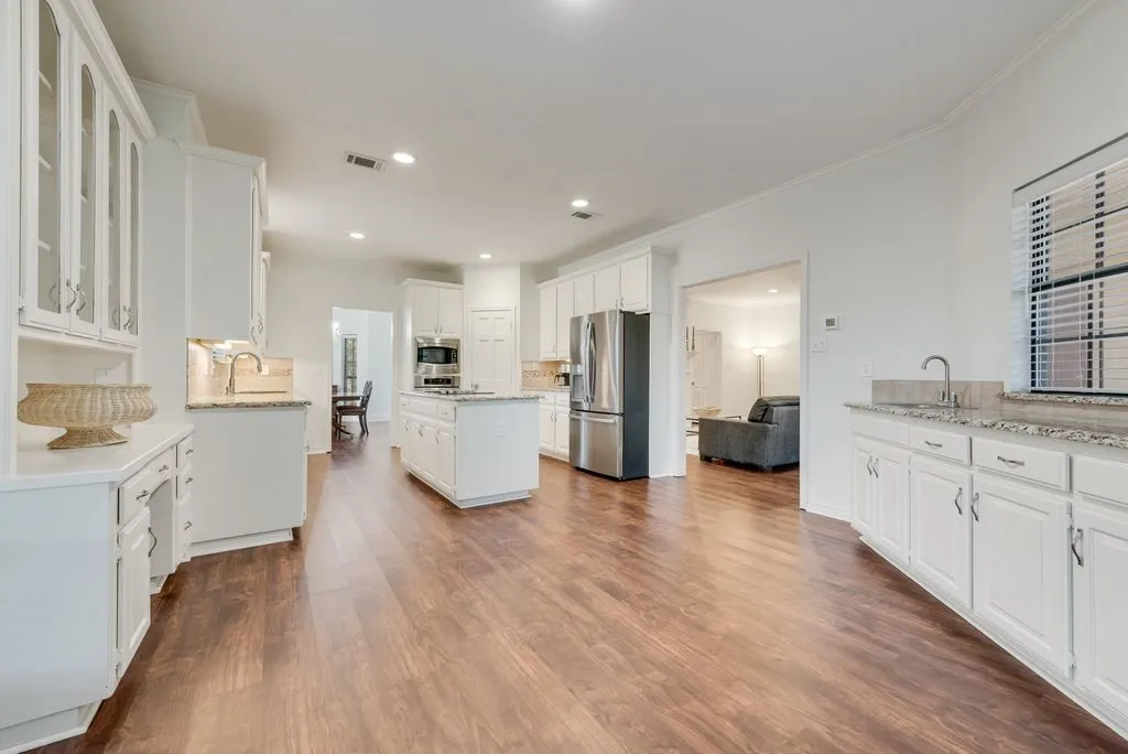Stunning breakfast area with built in buffet and separate sink.