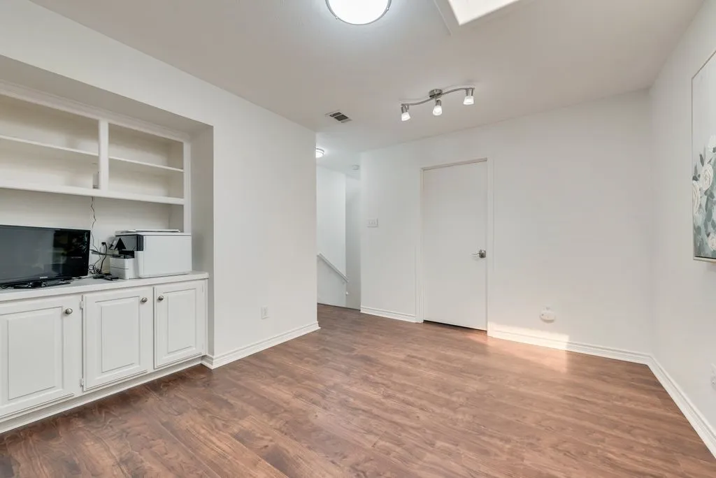 Upstairs landing with built ins.
