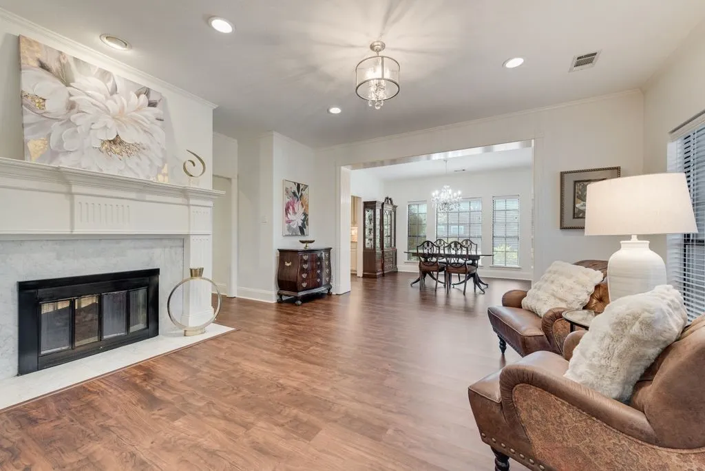 This elegant home offers a grand entrance with staircase and formal living areas.