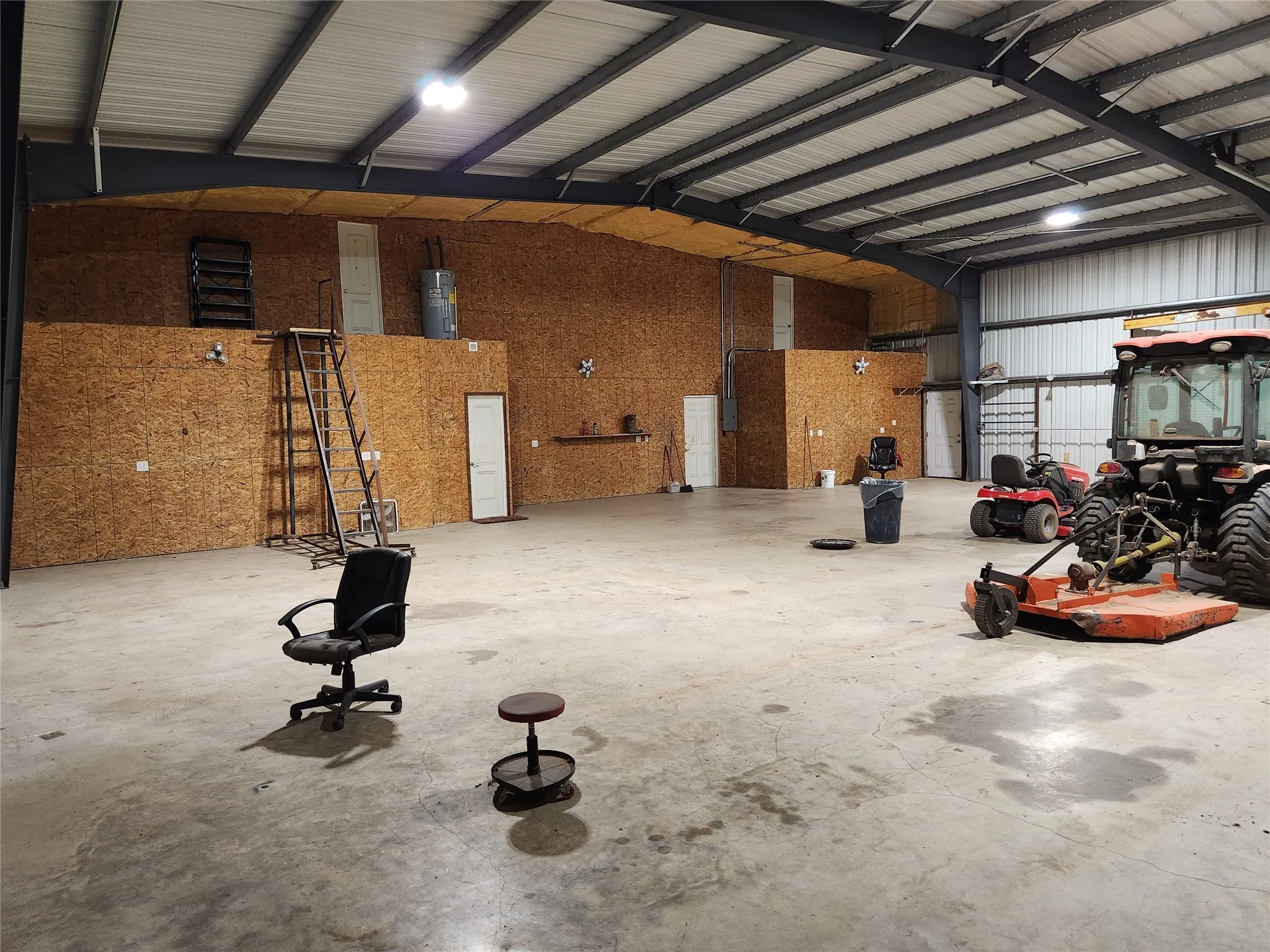 Large shop space, includes access to the attic.