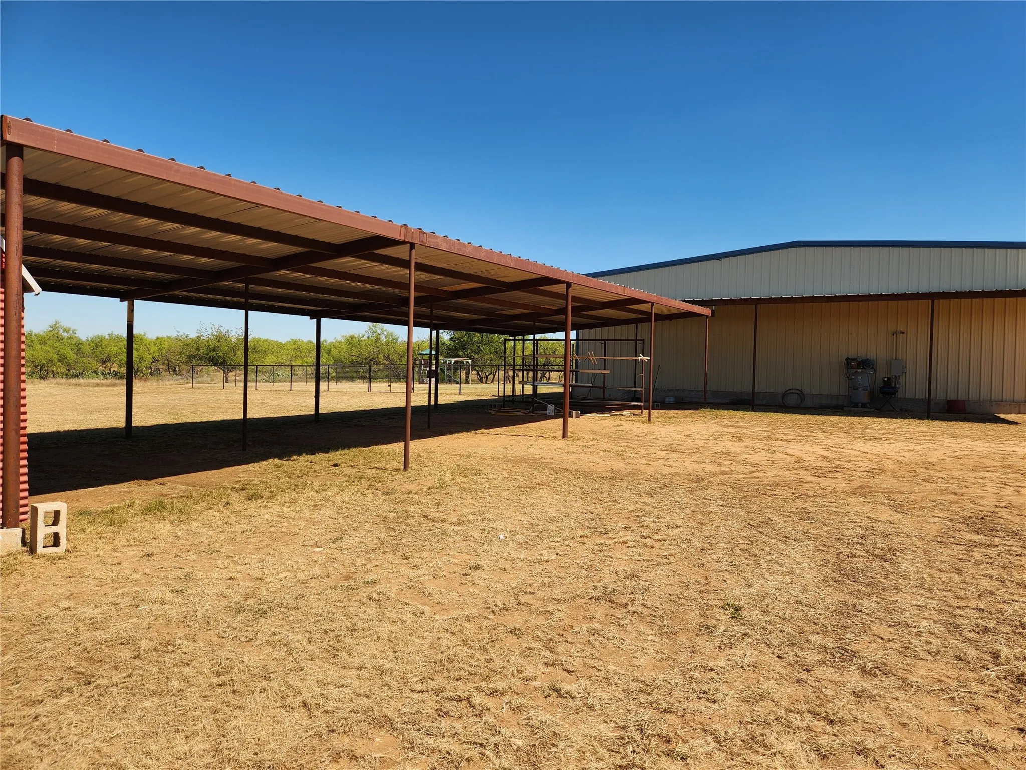 Shade structure, could be converted to animal stalls.