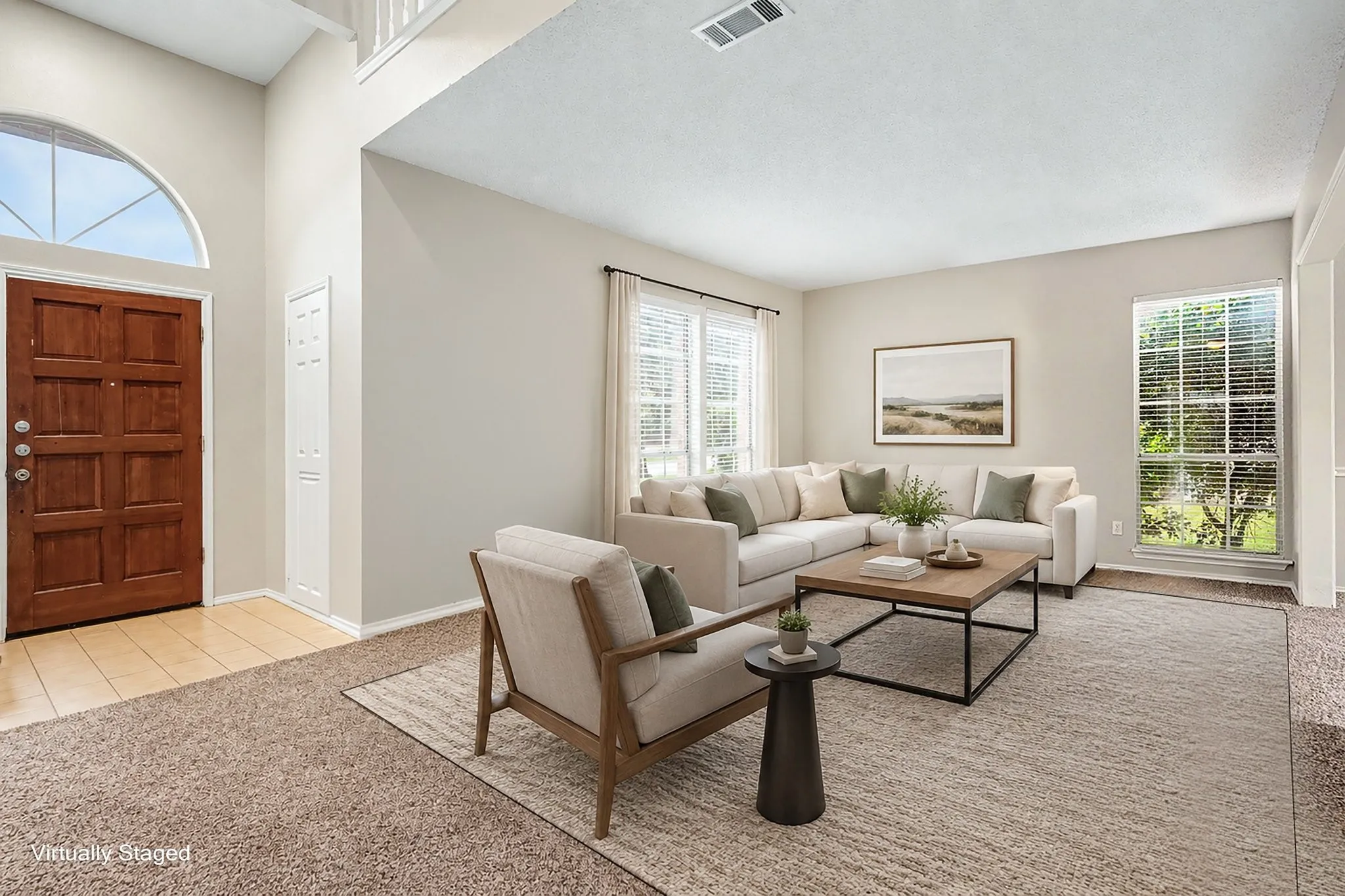 View of the virtually staged separate formal living room by the front entrance