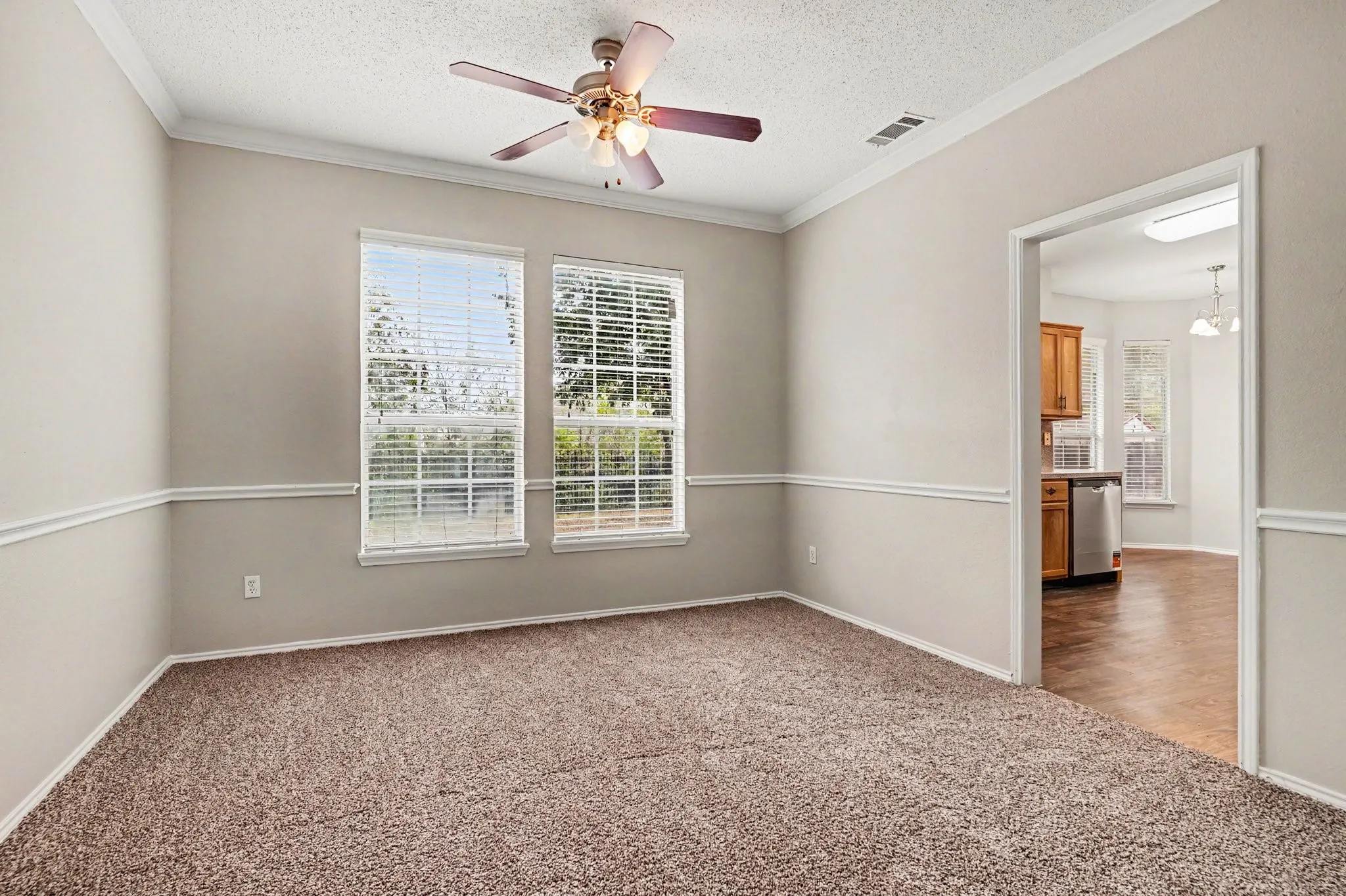 View into the formal dining room. Open to the living room.