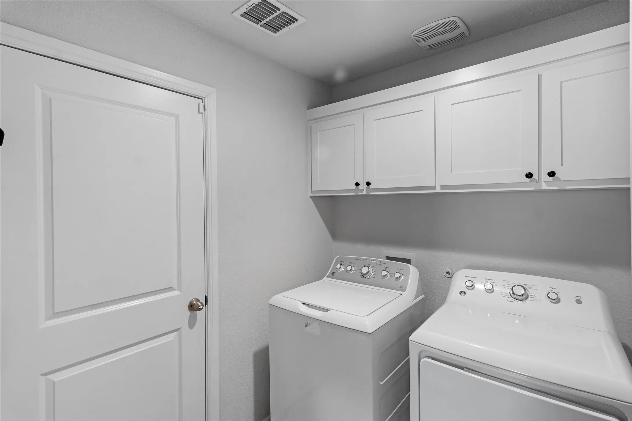 Laundry Room off Family Room, Hallway, Garage Door