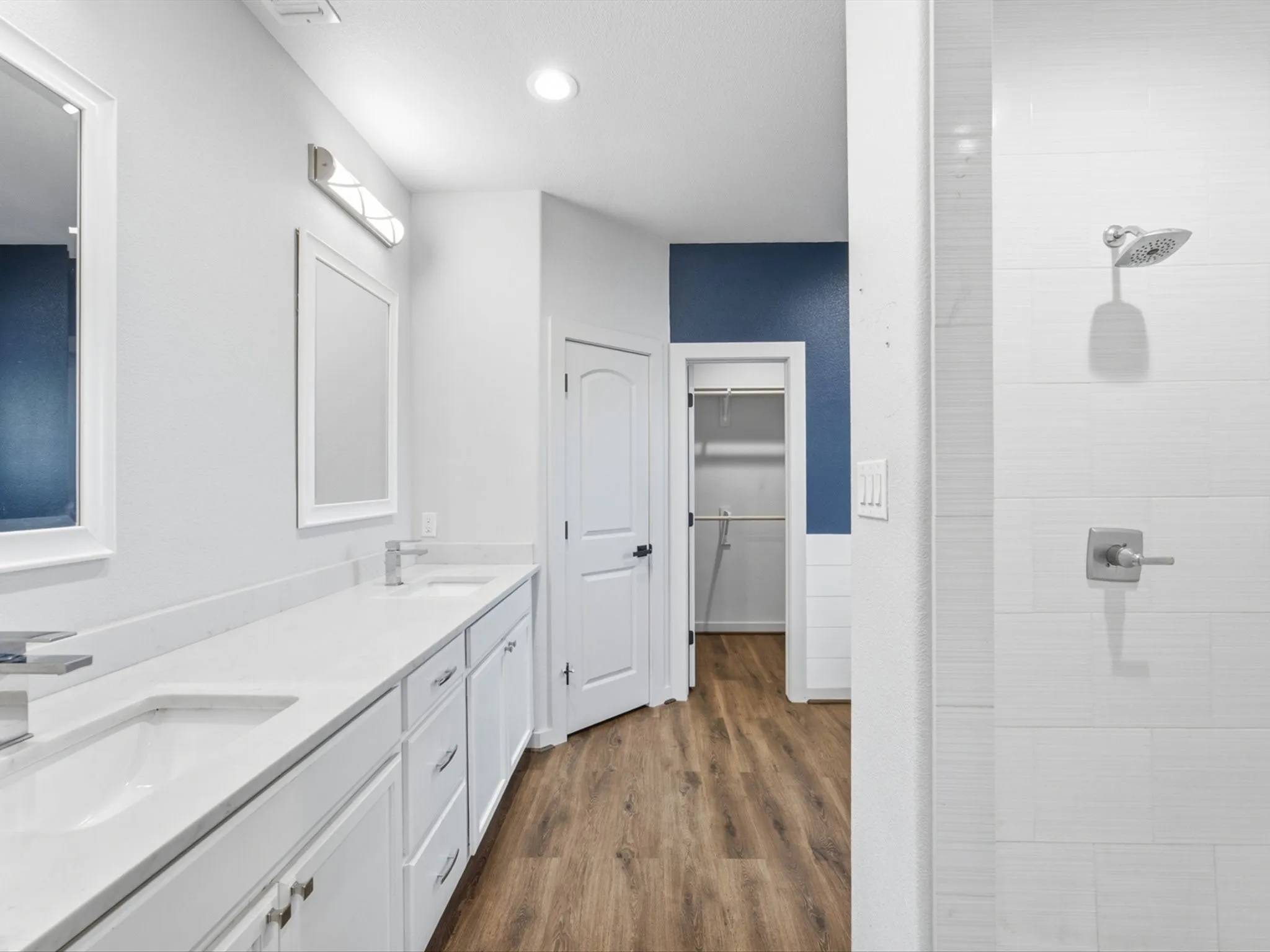 double sinks, separate shower and tub and a water closet