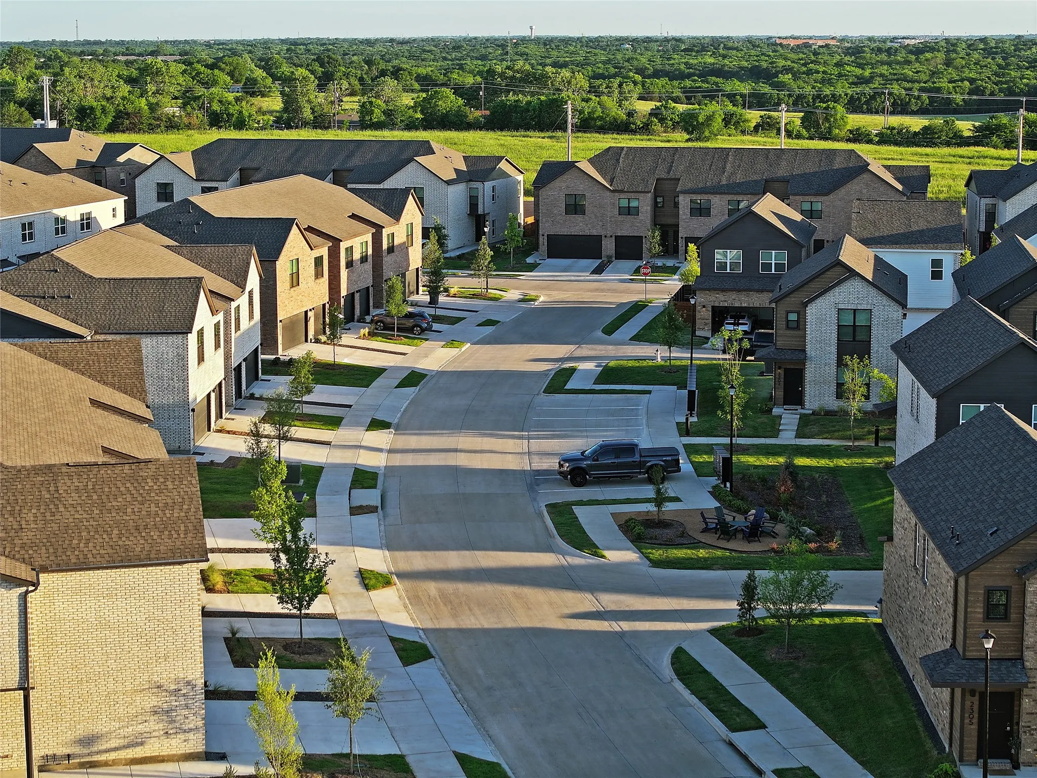 Aerial view of residential area featuring a heavily wooded area
