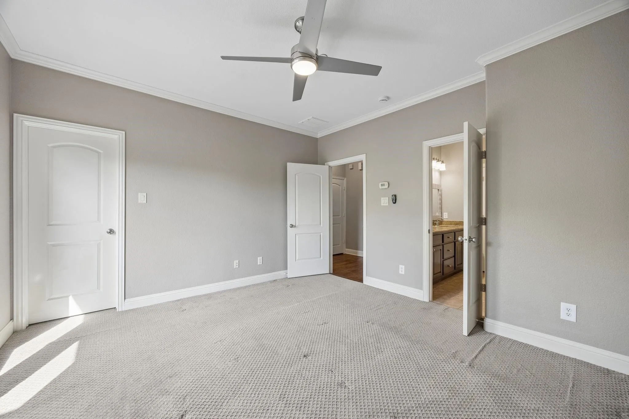 Crown molding and a ceiling fan with integrated lighting