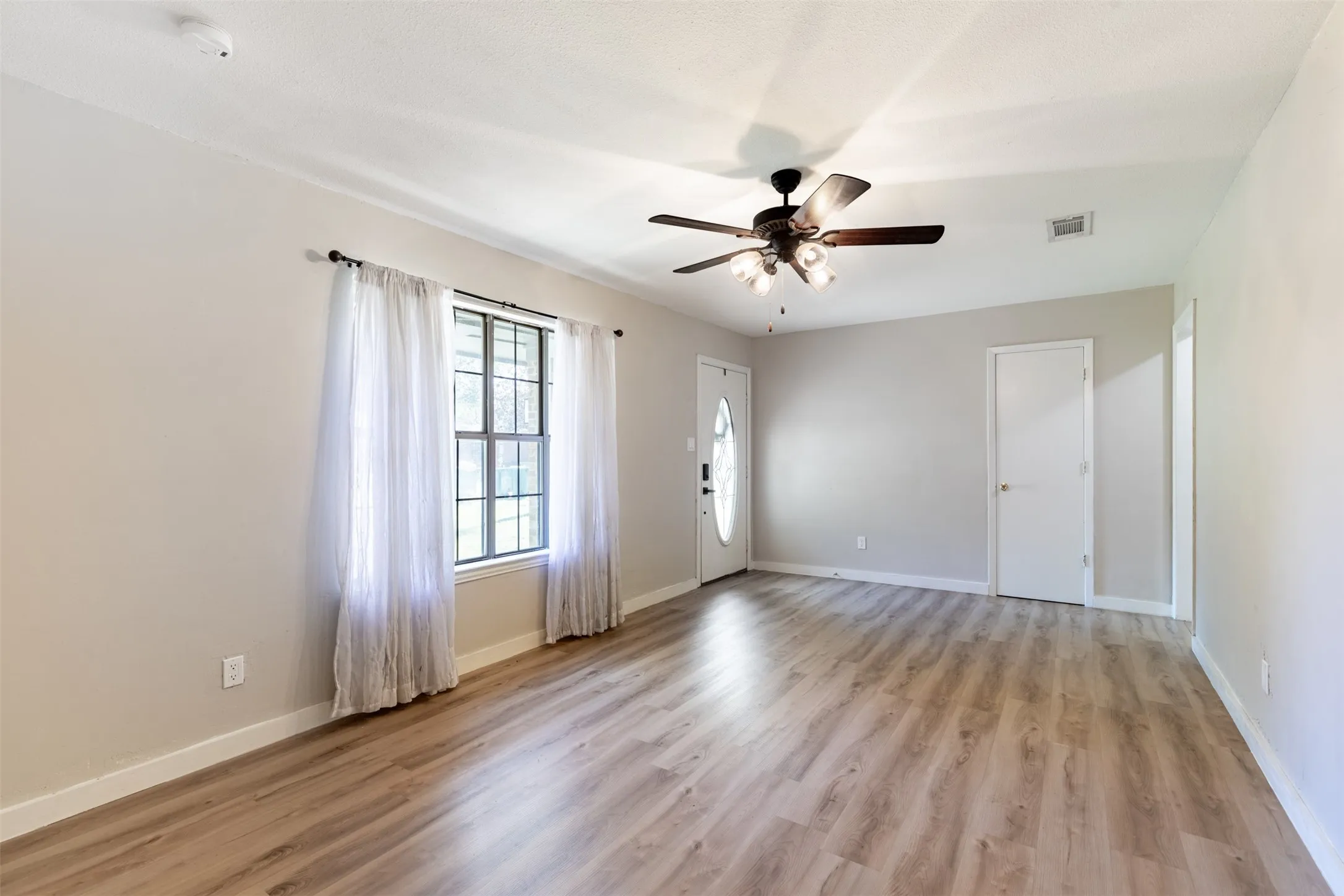 Living room flows effortlessly to dining room.