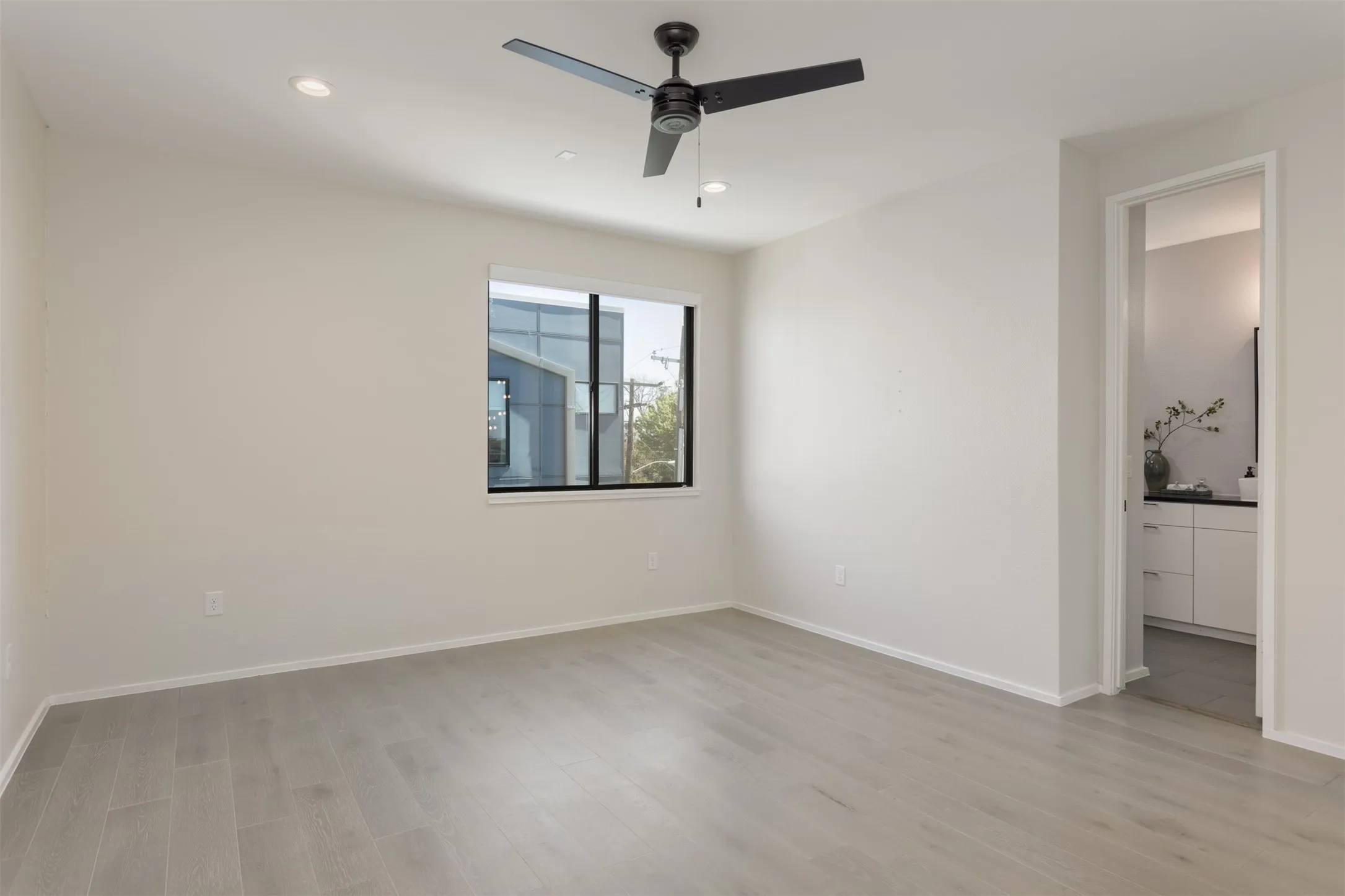 Spare room featuring recessed lighting, light wood-style floors, and a ceiling fan