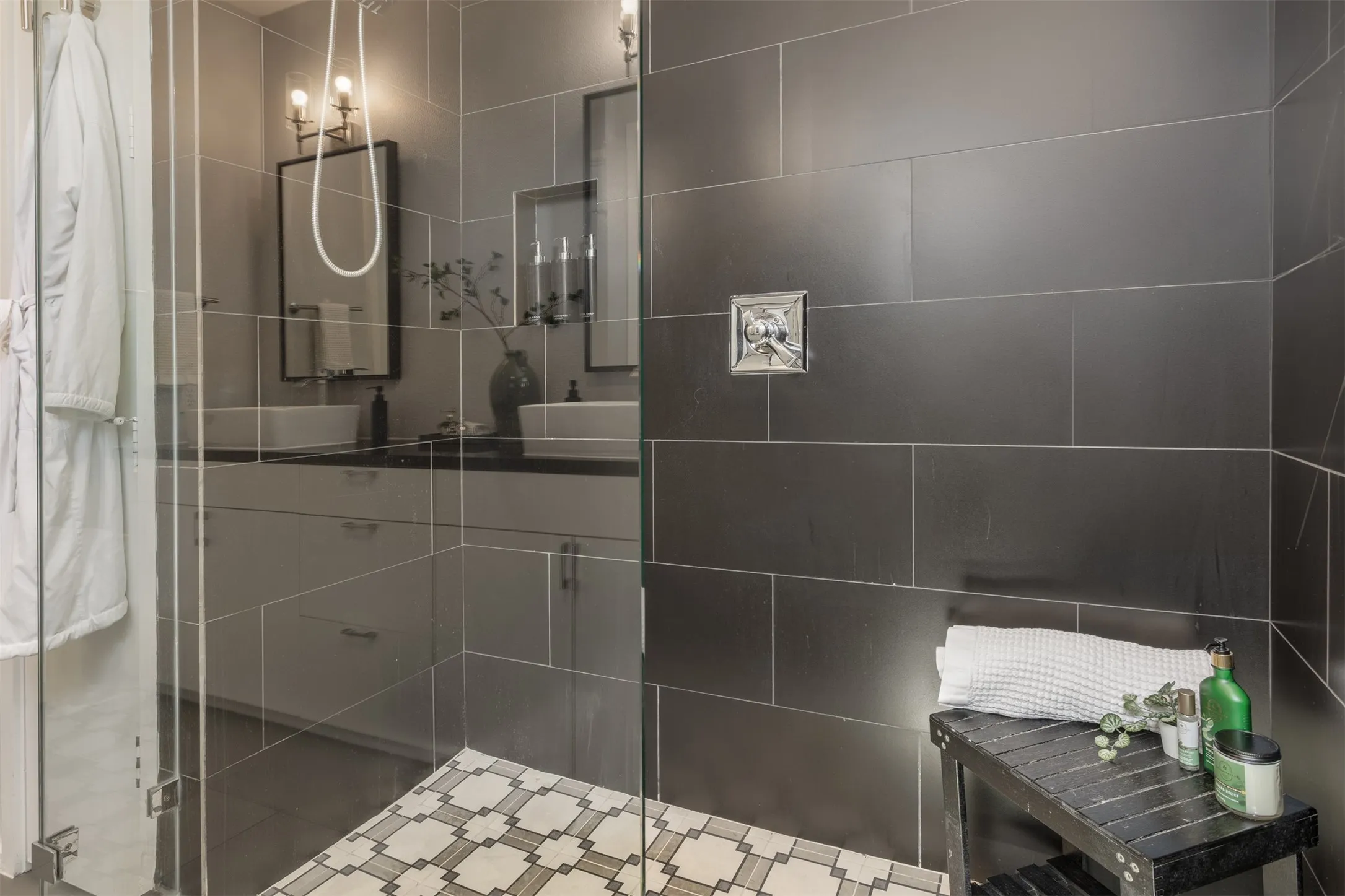 Full bathroom with vanity and a stall shower