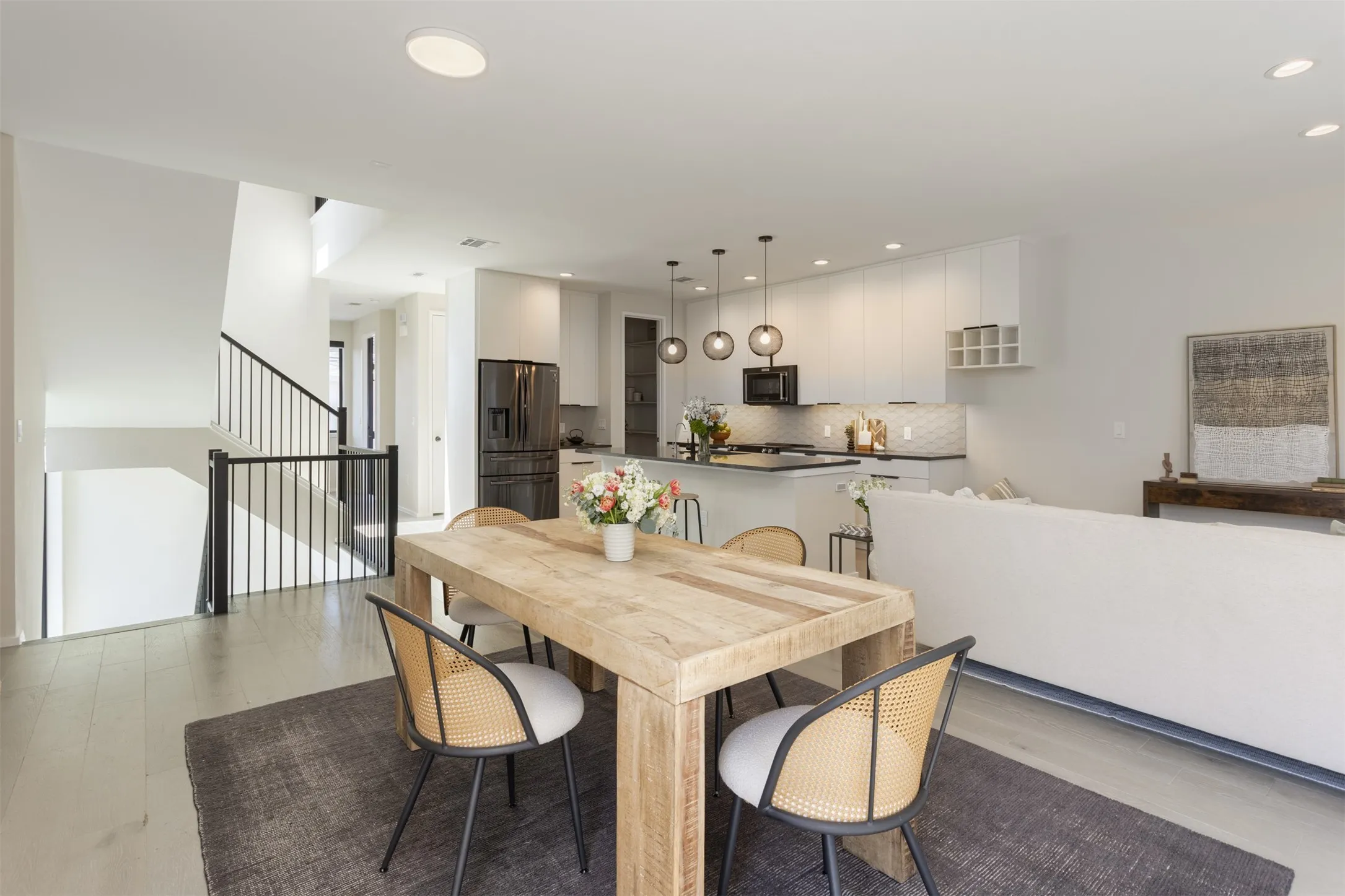 Dining space featuring light wood finished floors and recessed lighting
