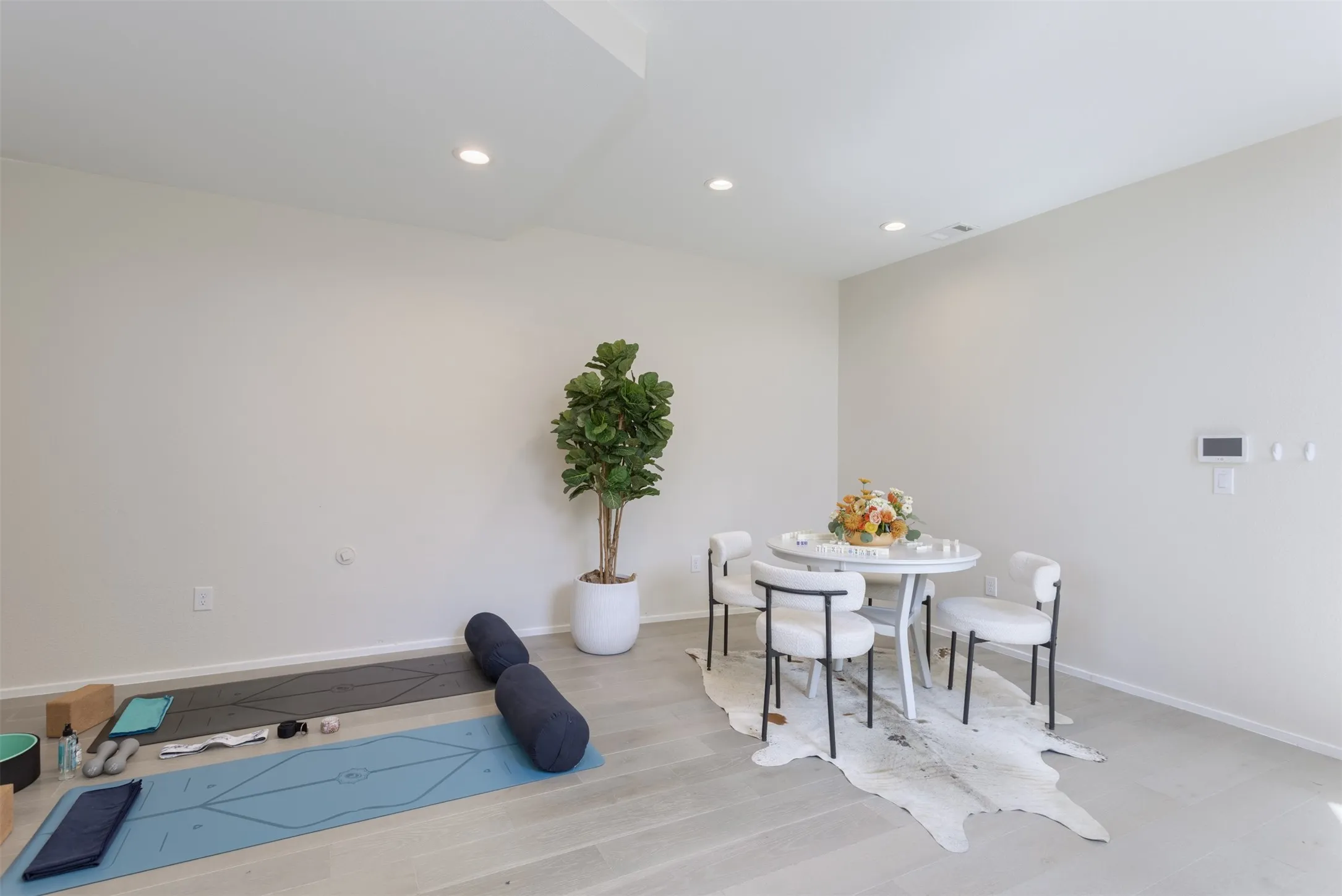 Dining room featuring light wood-style flooring and recessed lighting