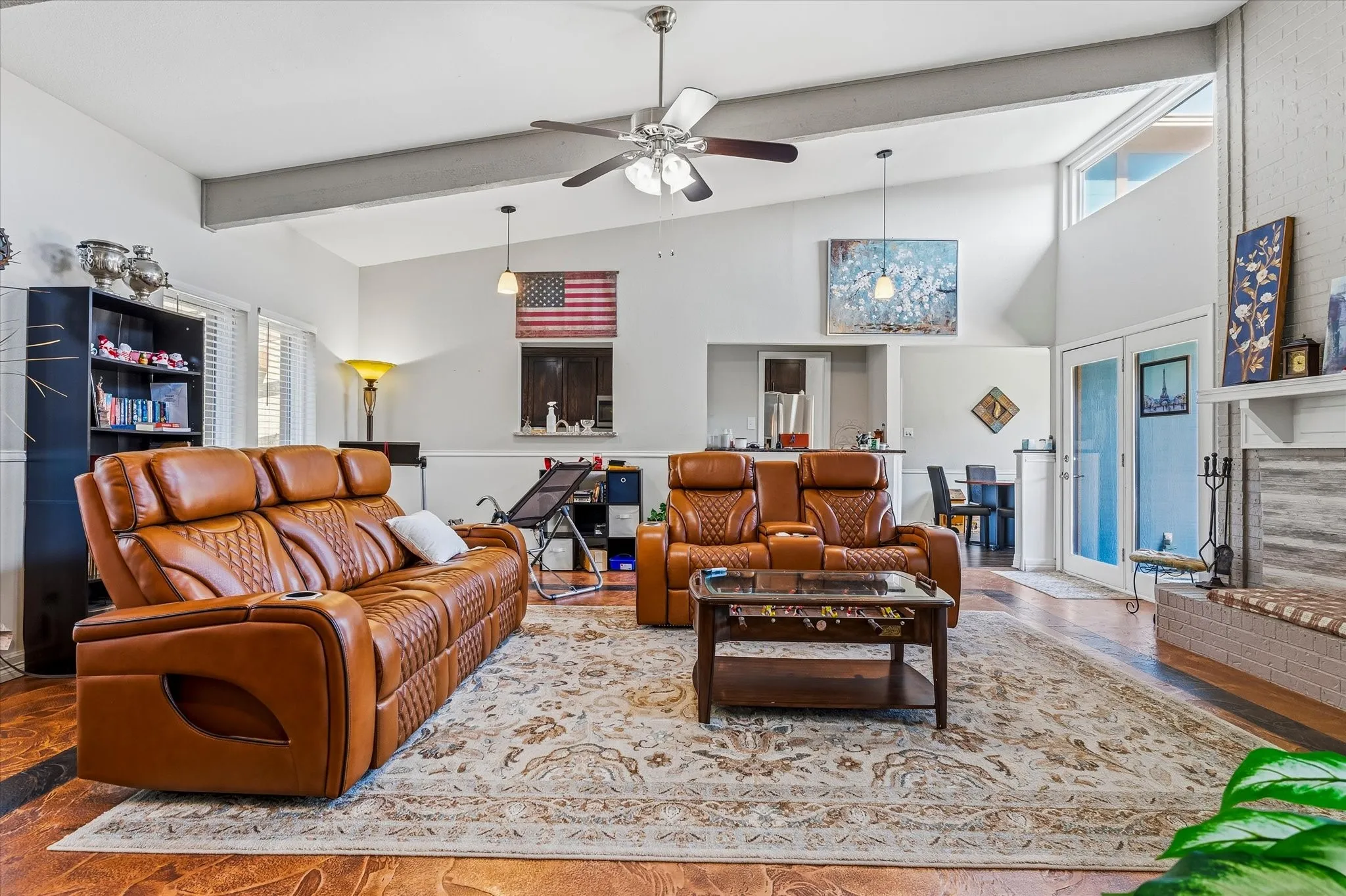 Vaulted ceilings with exposed beams, ceiling fan, and recessed lighting