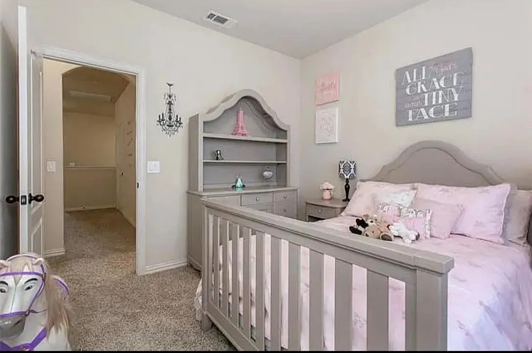 Bedroom with light colored carpet