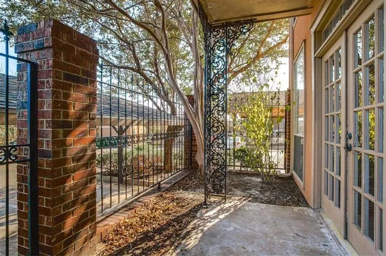 Quiet, shaded patio, ready for your favorite planting!