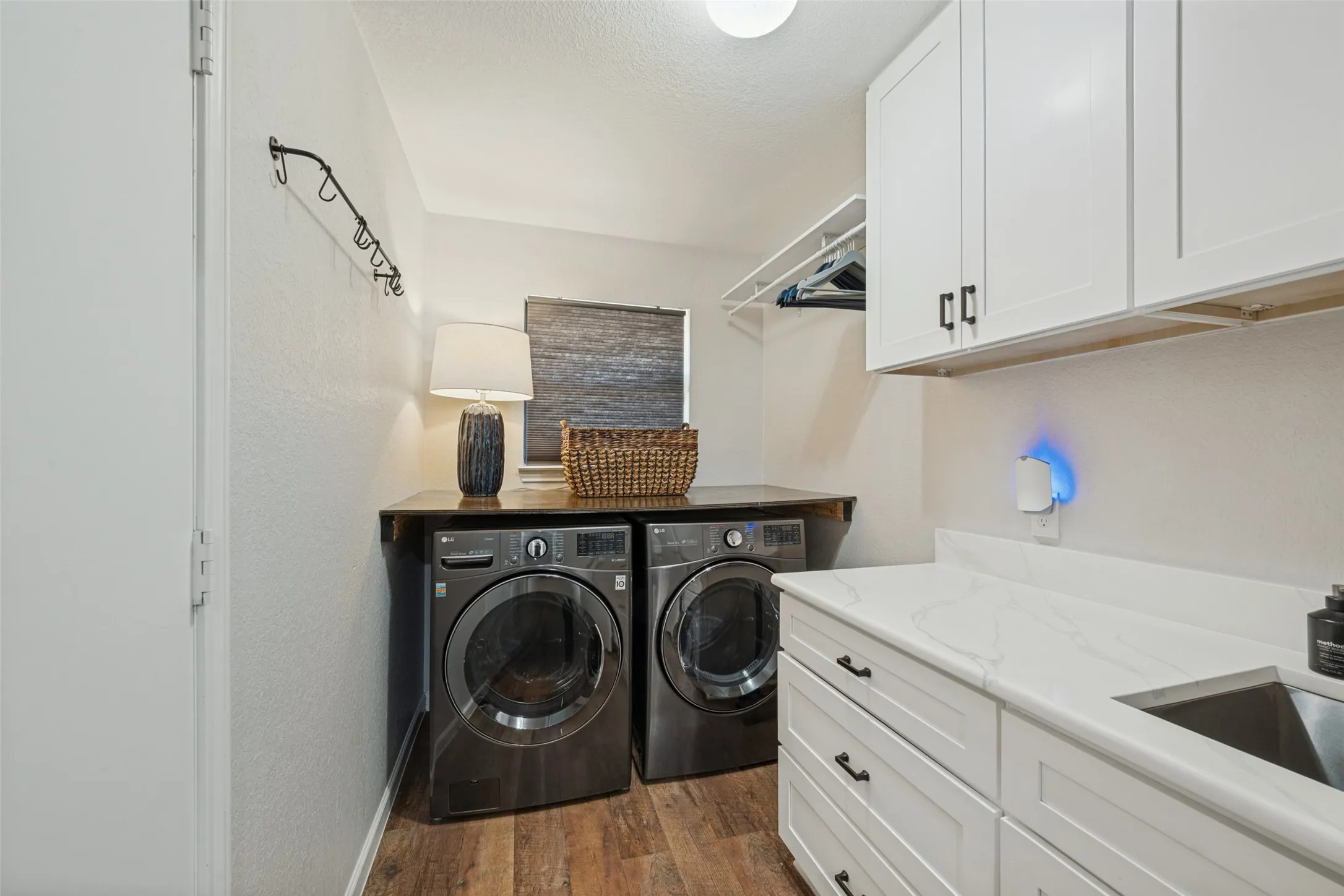 Awesome Laundry Room with Built-in Cabinets, Sink, and Floding TAble