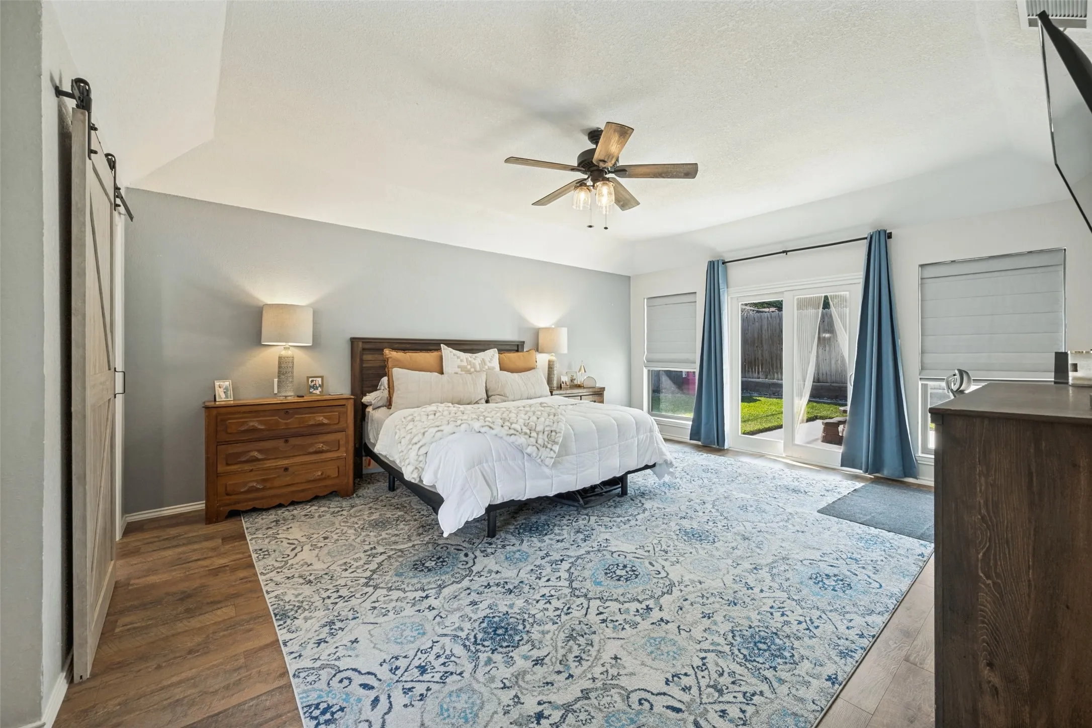 Very Spacious Primary Bedroom with Laminate Wood Flooring