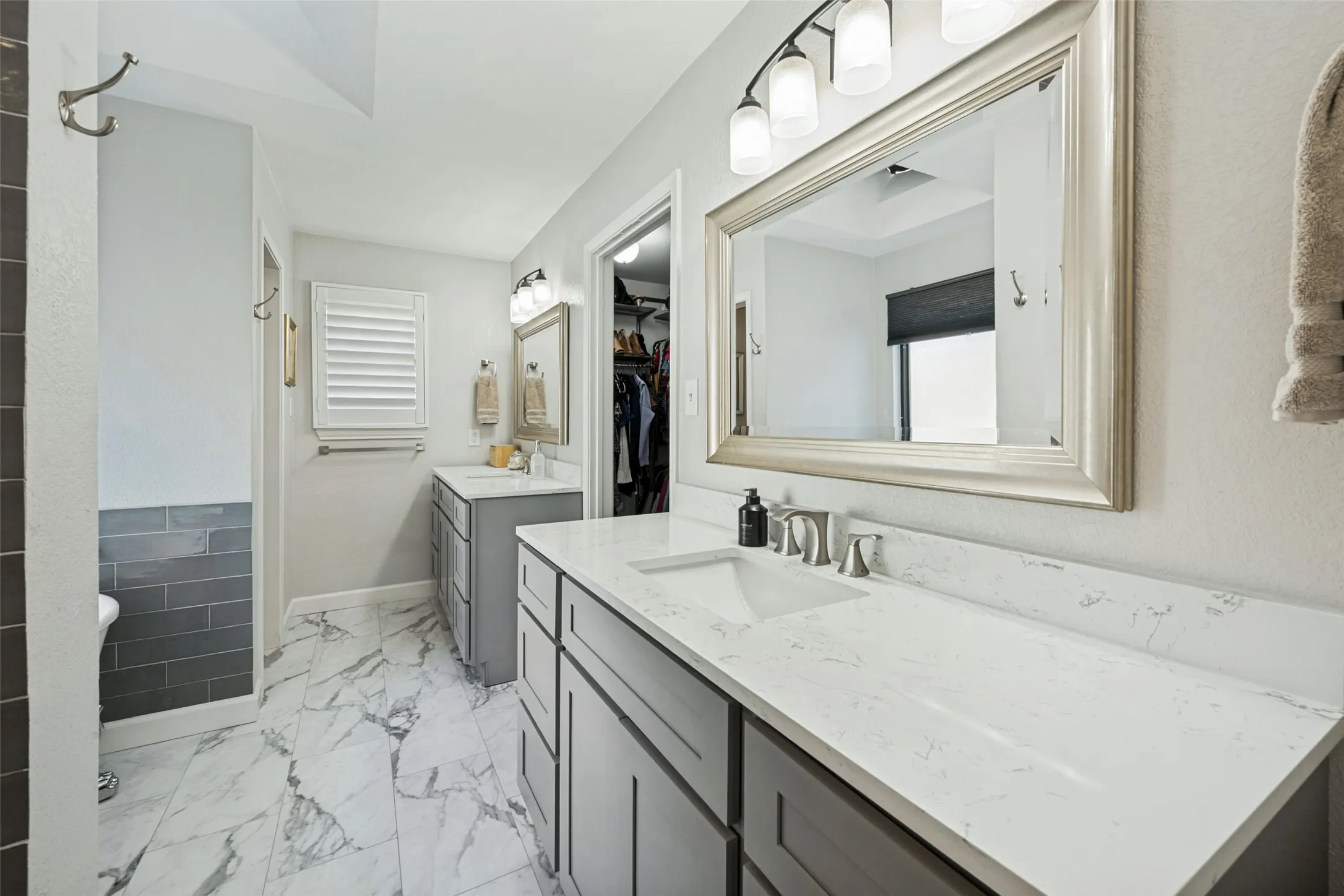 Beautifully Updated Primary Bathroom with Separate Vanities
