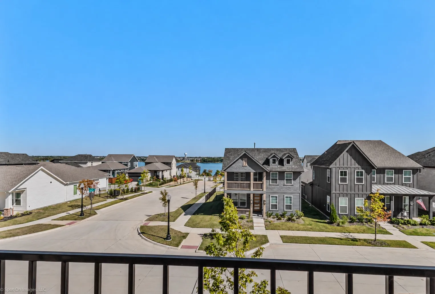 Neighborhood with a street, sidewalks, and residential structures