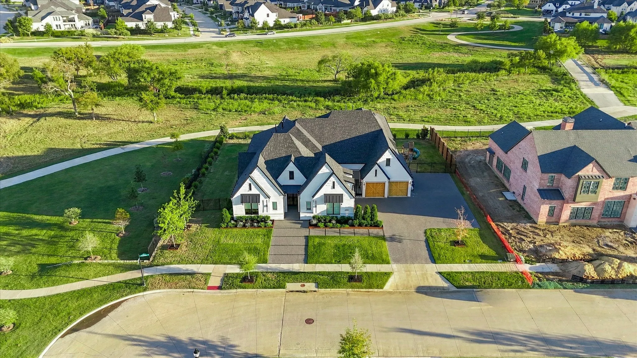 White exterior with dark trim and multiple gables