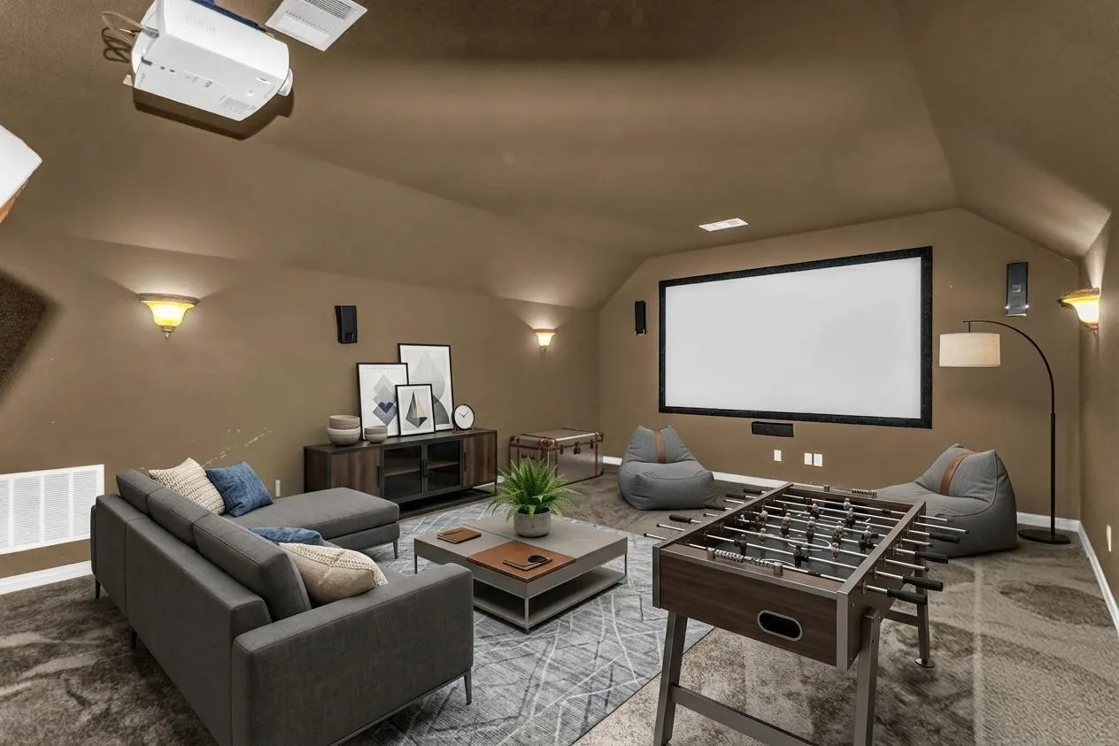 Integrated ceiling projector, large projection screen, built-in wall sconces, ceiling-mounted speakers, and sloped ceiling design