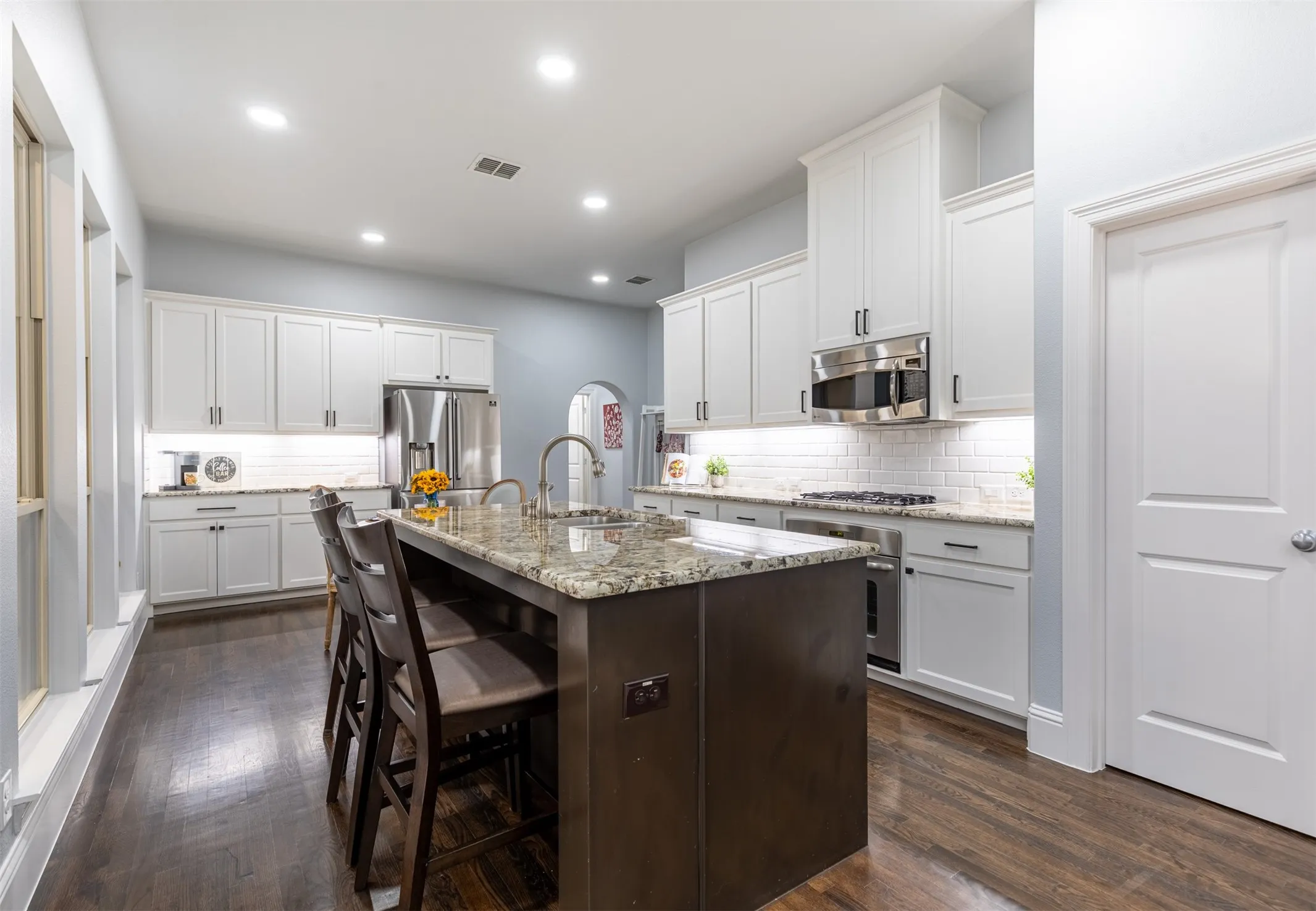 Kitchen features granite countertops and oversized pantry.