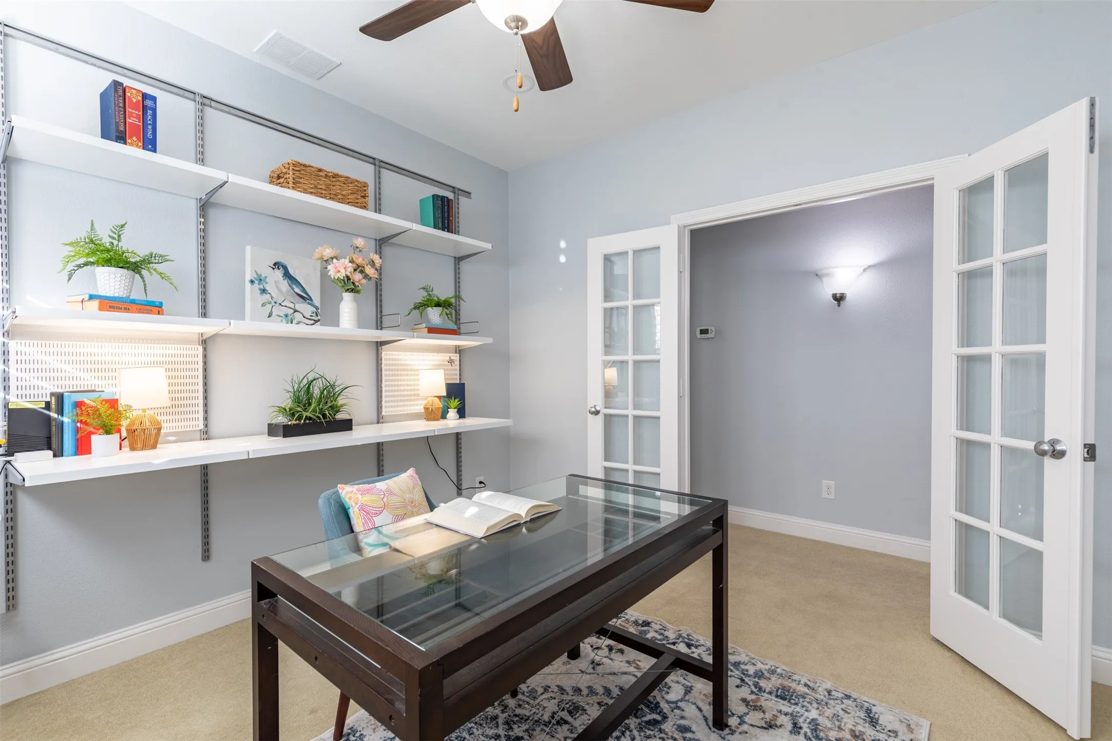 Office with glass French door entry.