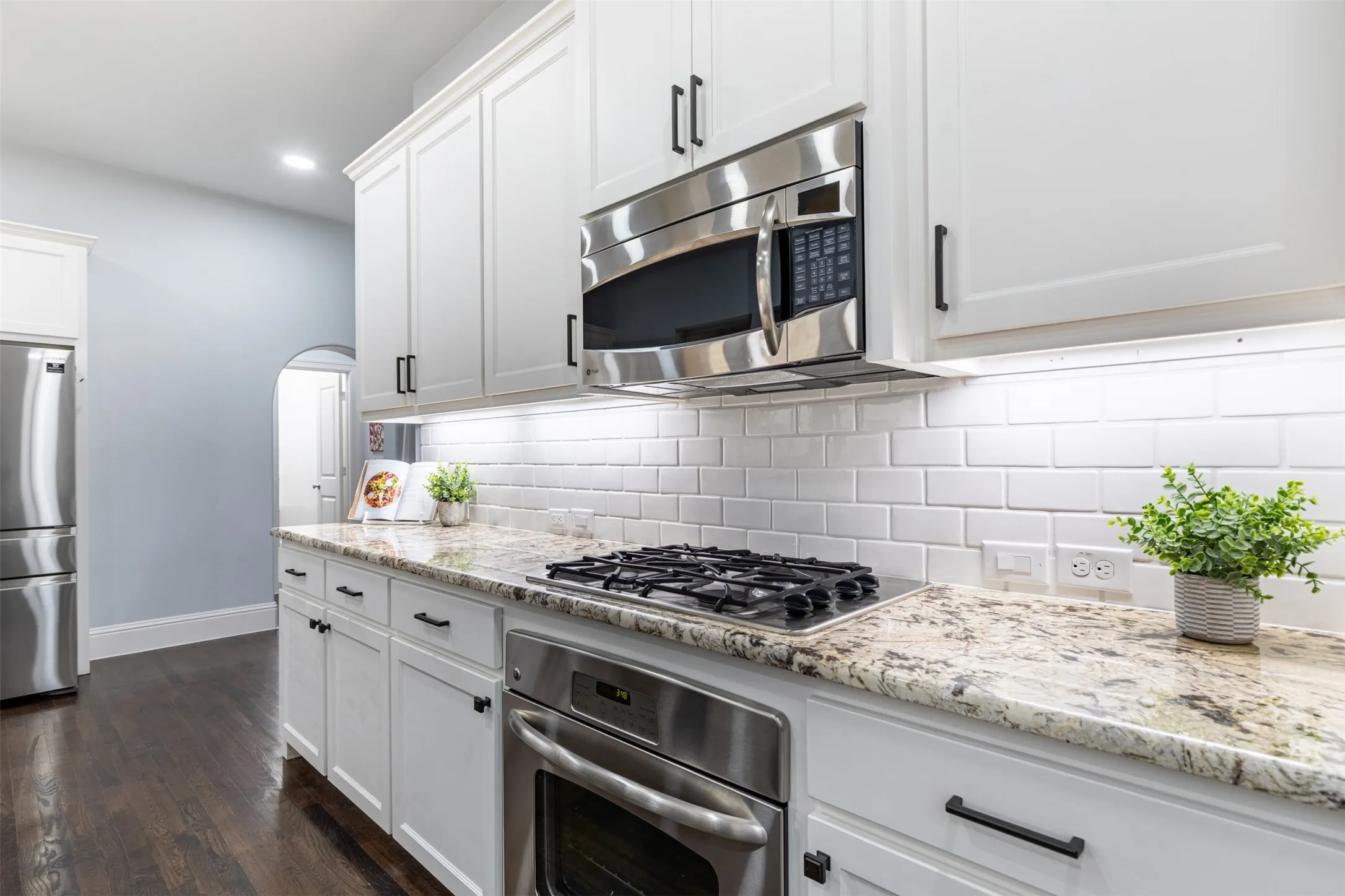 Kitchen with stainless steel appliances including gas cooktop.