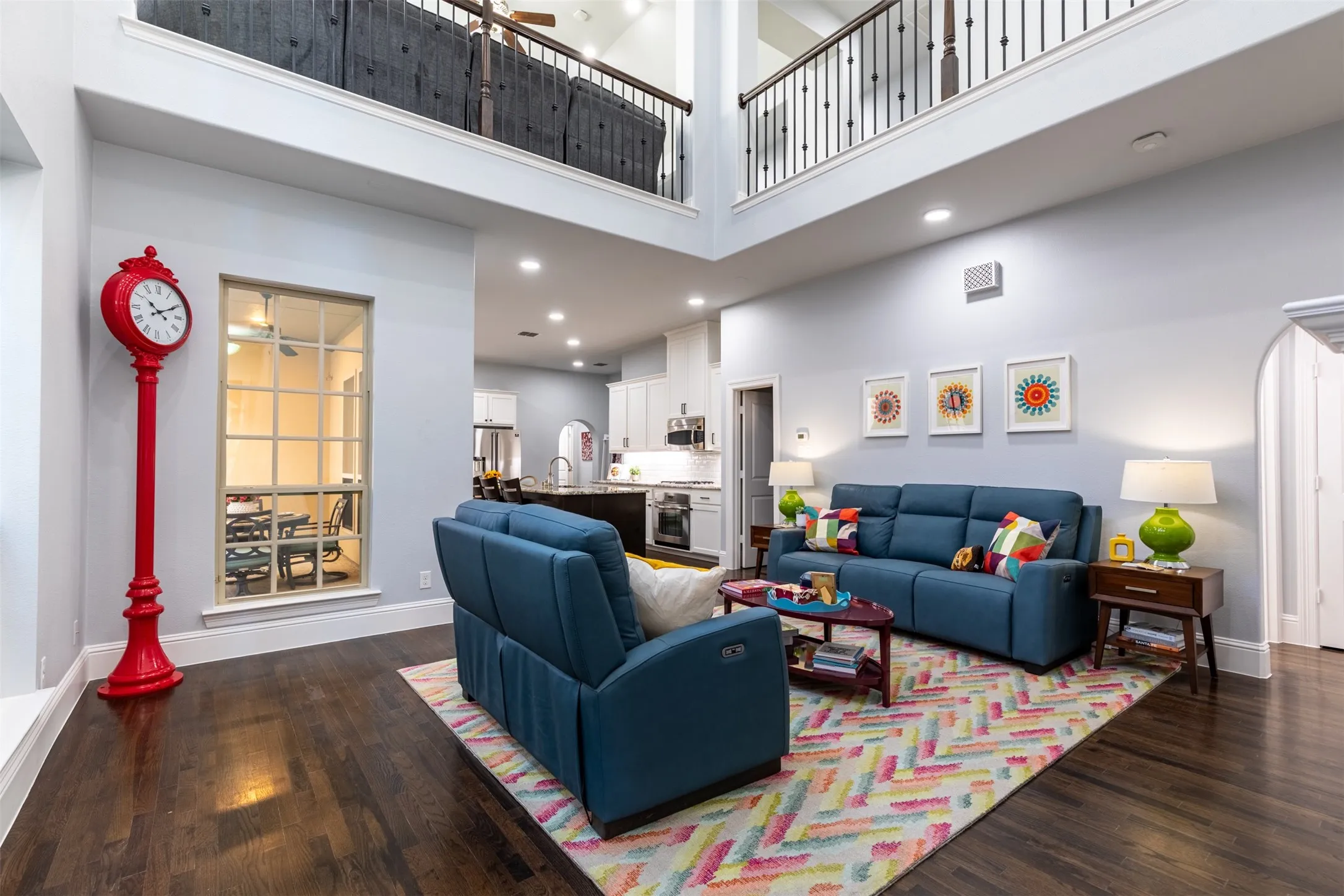 Entry features two-story ceiling and opens into spacious living room.