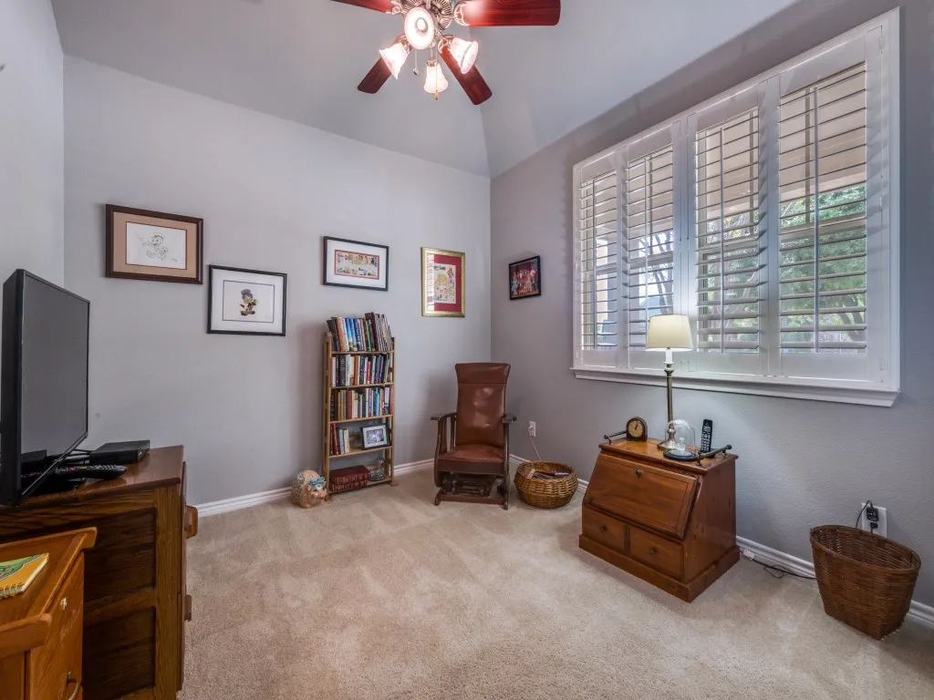 Bedroom 3 offers flexible living space, shown here as a cozy sitting room