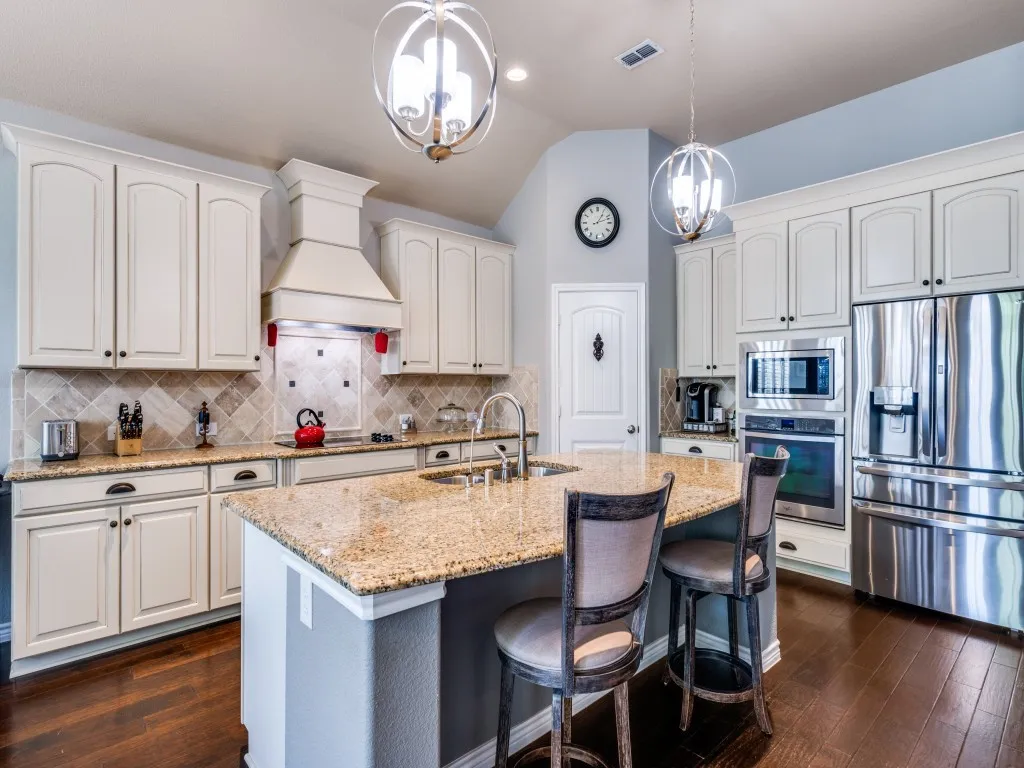 The kitchen offers a functional layout with ample workspace, generous cabinetry, and an easy flow for everyday living