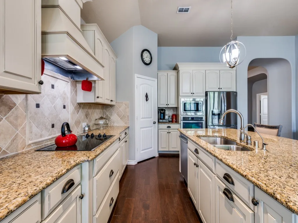 The kitchen offers a functional layout with ample workspace, generous cabinetry, and an easy flow for everyday living
