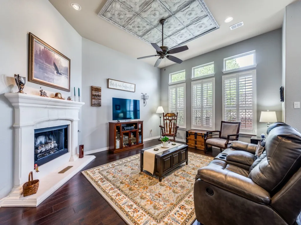 A cozy fireplace creates the perfect focal point for this warm and inviting living space